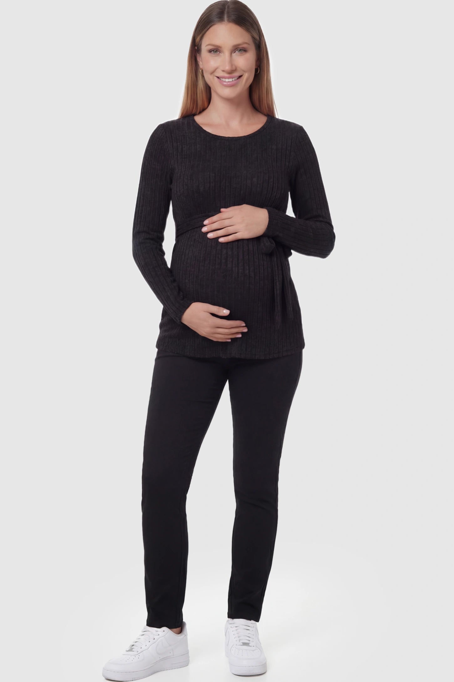 Ribbed Tie-Waist Long Sleeve Maternity Top Ribbed Tie-Waist Long Sleeve Maternity Top in Black featuring an adjustable waist on a pregnant model.