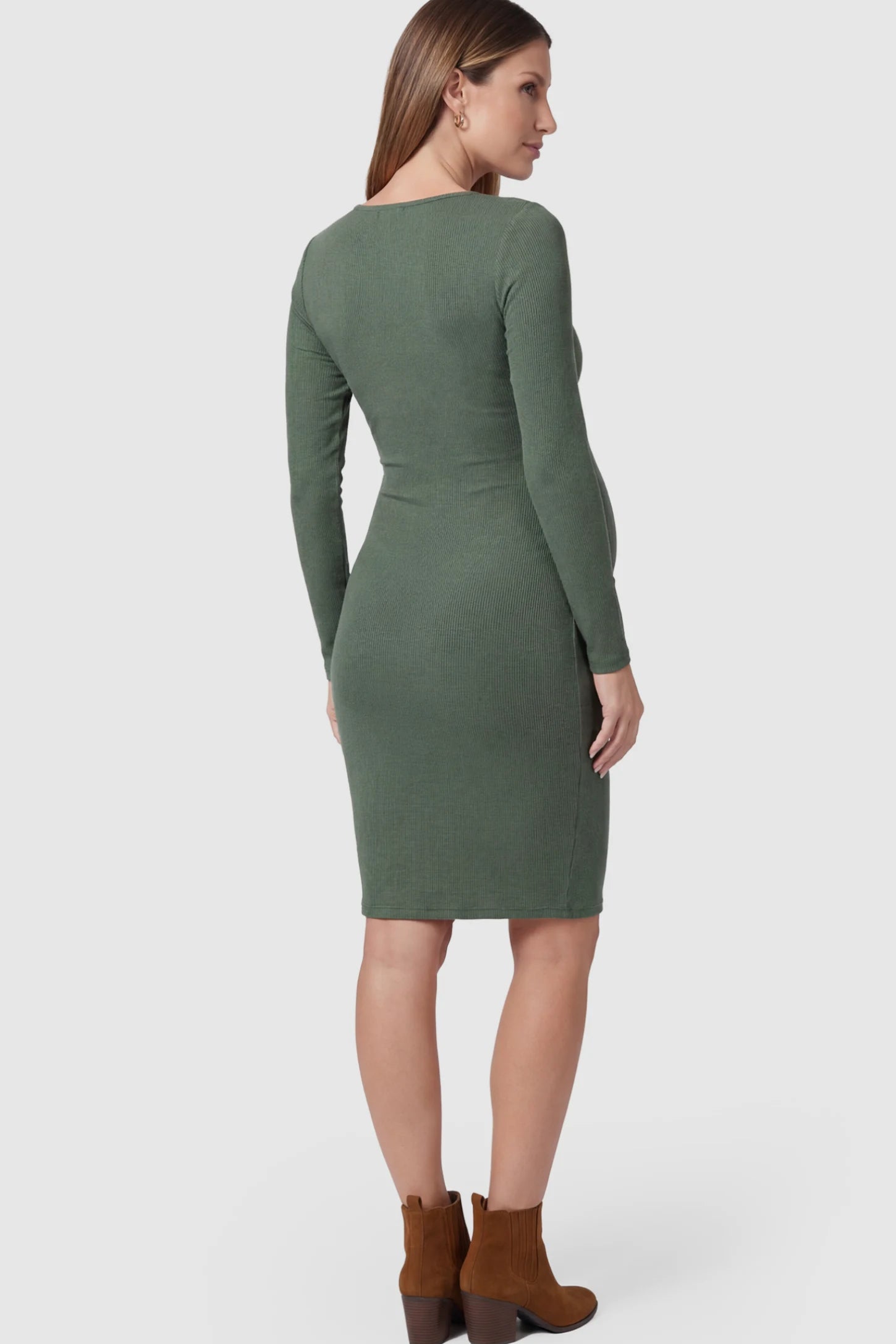 Ribbed Twist Front Long Sleeve Bodycon Maternity Short Dress Twist-Front Long Sleeve Ribbed Maternity Mini Dress in Green featuring a textured knit finish on a pregnant model.