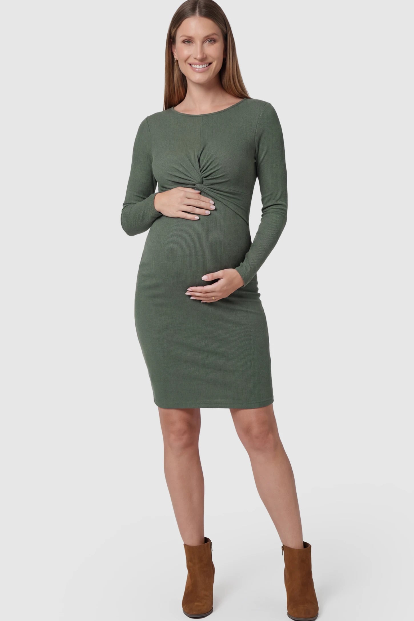 Twist-Front Long Sleeve Ribbed Maternity Mini Dress in Green featuring a textured knit finish on a pregnant model.