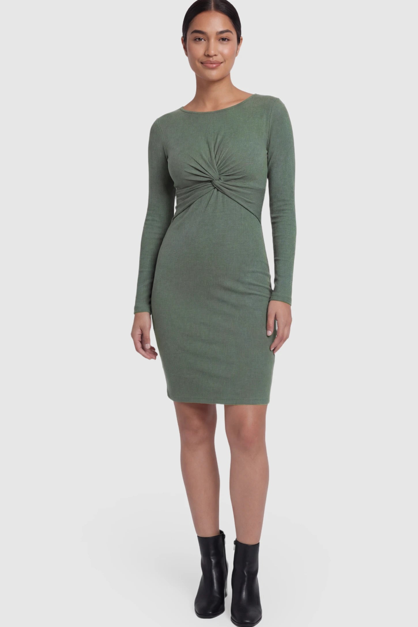 Ribbed Twist Front Long Sleeve Bodycon Maternity Short Dress Twist-Front Long Sleeve Ribbed Maternity Mini Dress in Green featuring a textured knit finish on a postpartum model.