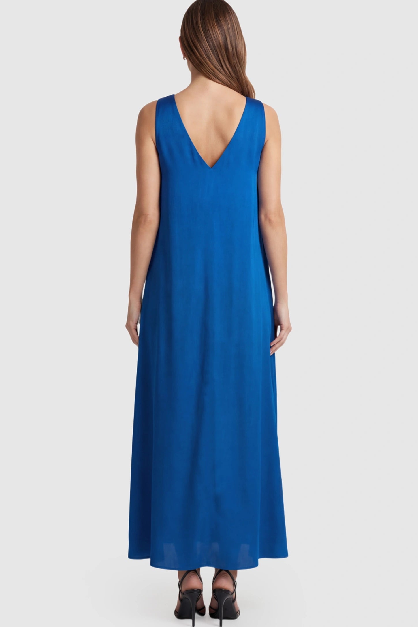 Solid Satin Tie-Waist Halter Maternity Maxi Dress Solid Satin Tie-Waist Halter Maxi Maternity Dress in Blue on a pregnant model.