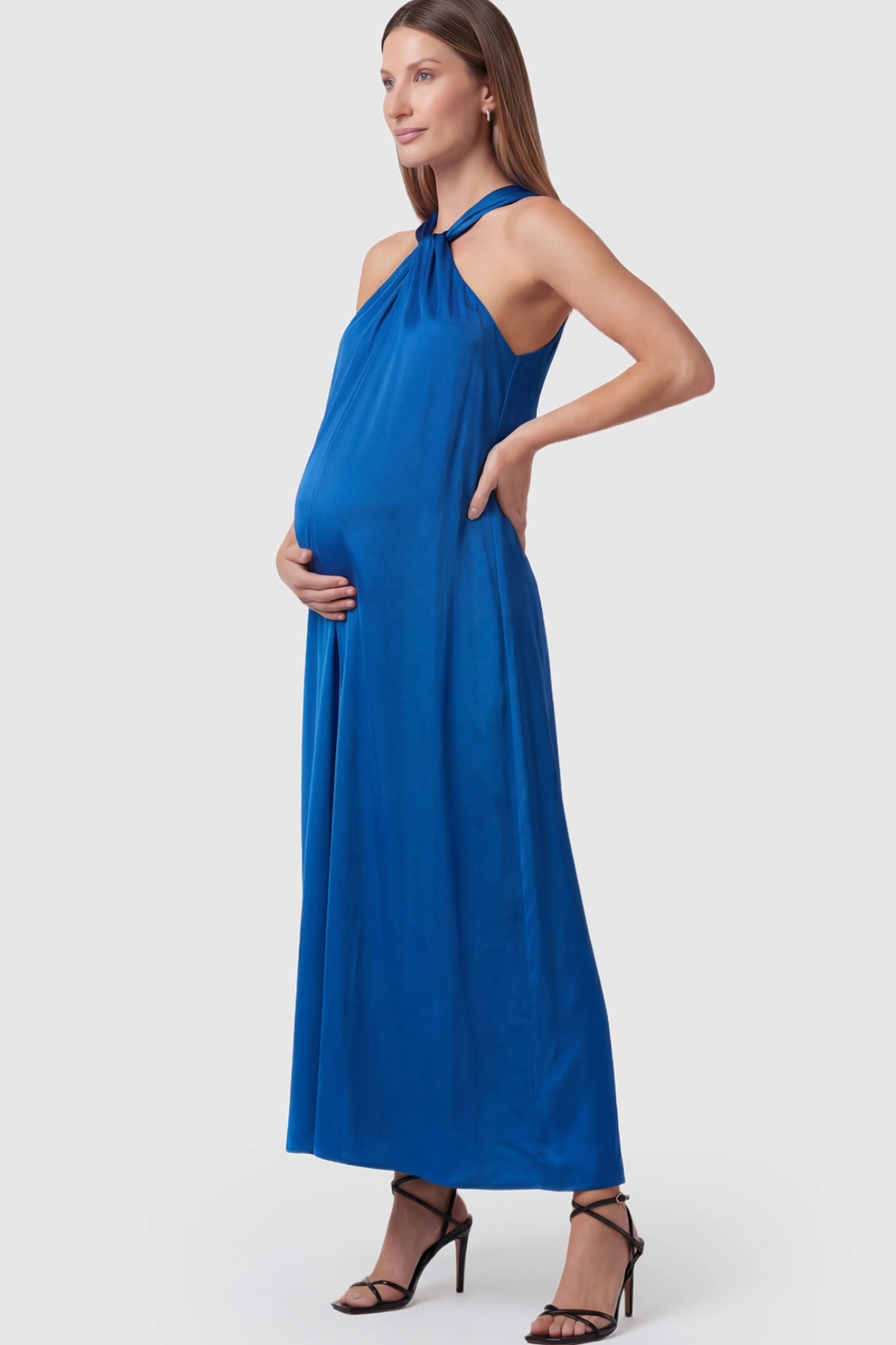 Solid Satin Tie-Waist Halter Maxi Maternity Dress in Blue on a pregnant model.