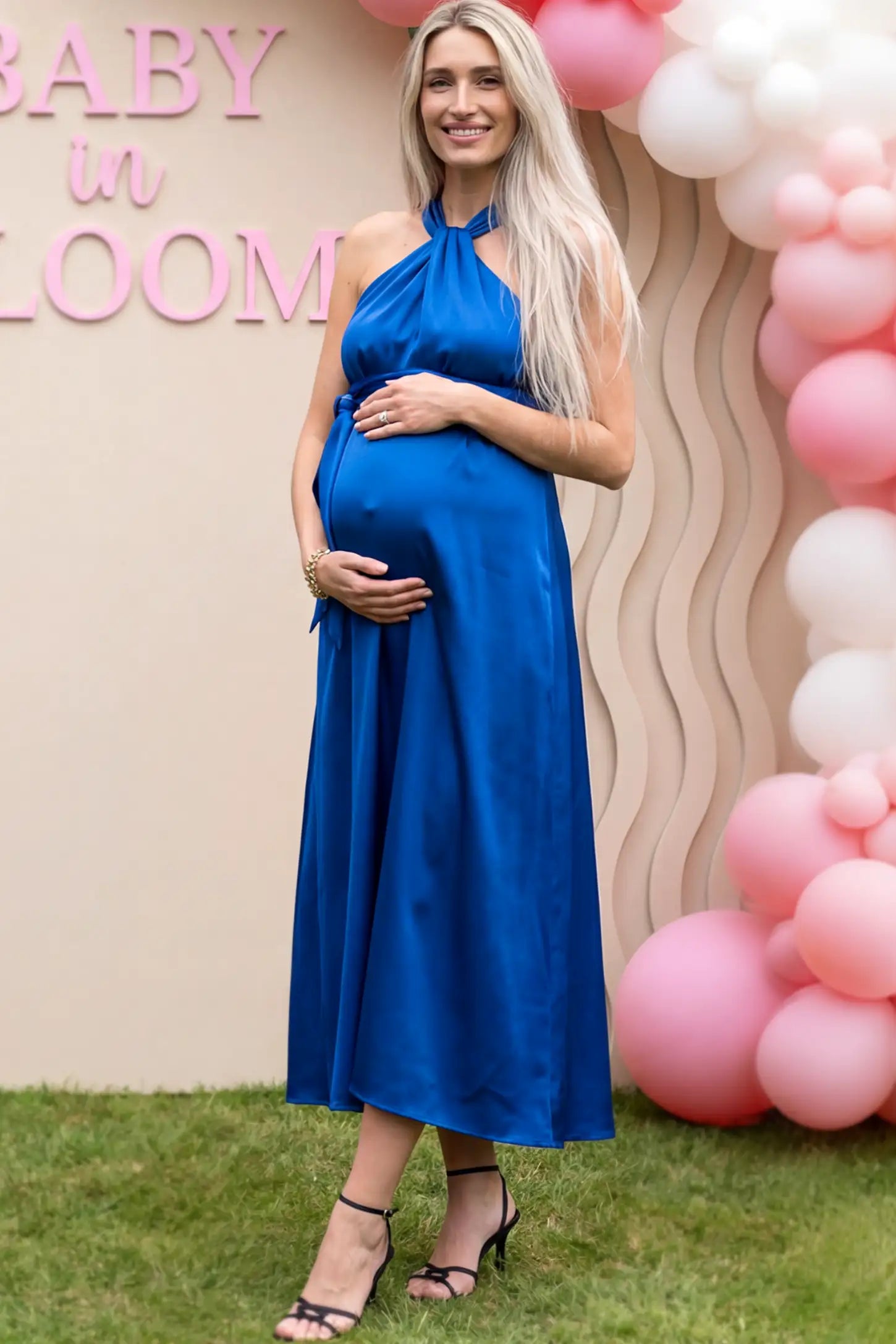Solid Satin Tie-Waist Halter Maxi Maternity Dress in Blue on a pregnant model.