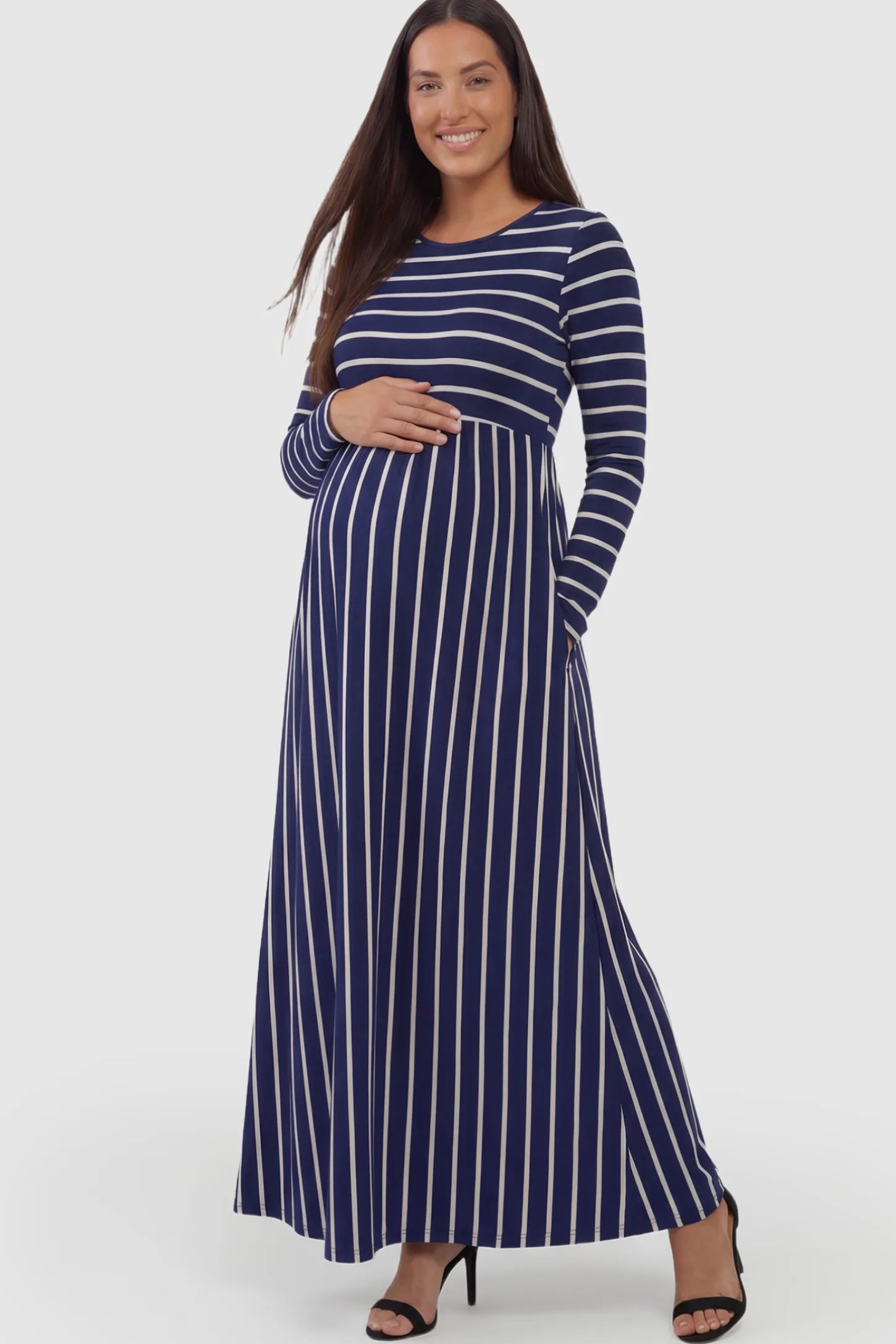 Stretch Jersey Mixed-Stripe Maternity Maxi Dress in dark blue and White featuring an empire waist on a pregnant model.
