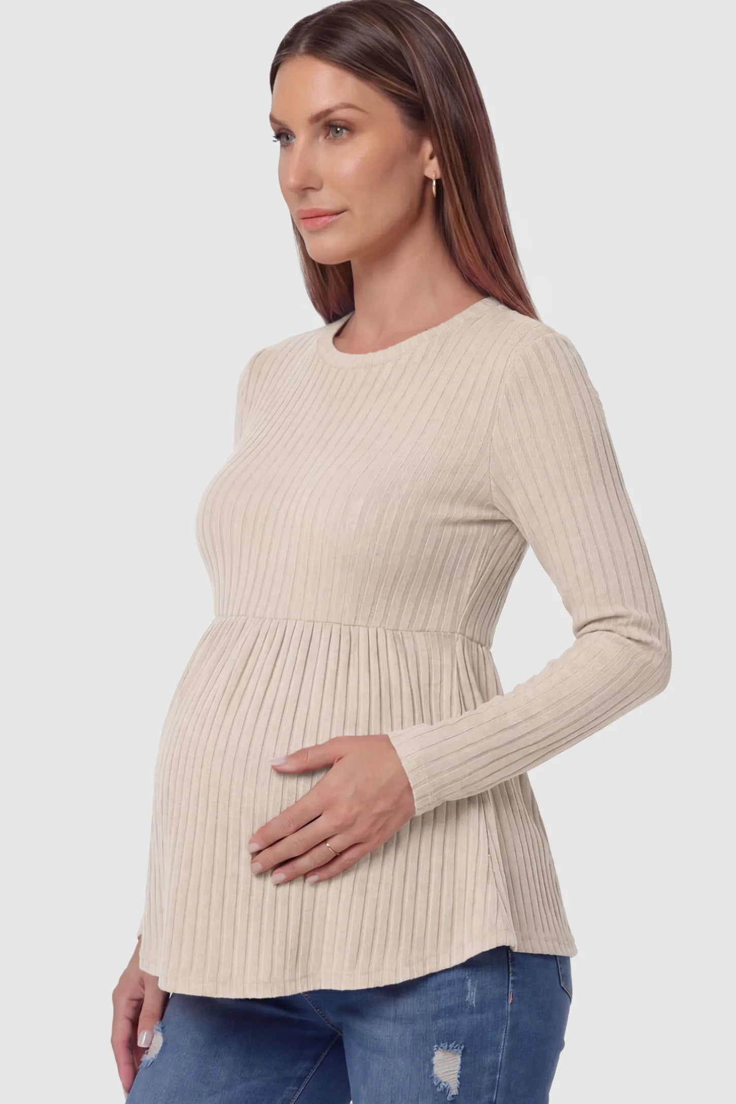 Ribbed Knit Long Sleeve Maternity Top Ribbed Knit Long Sleeve Maternity Top in Beige featuring an empire waist and high-stretch fabric on a pregnant model.