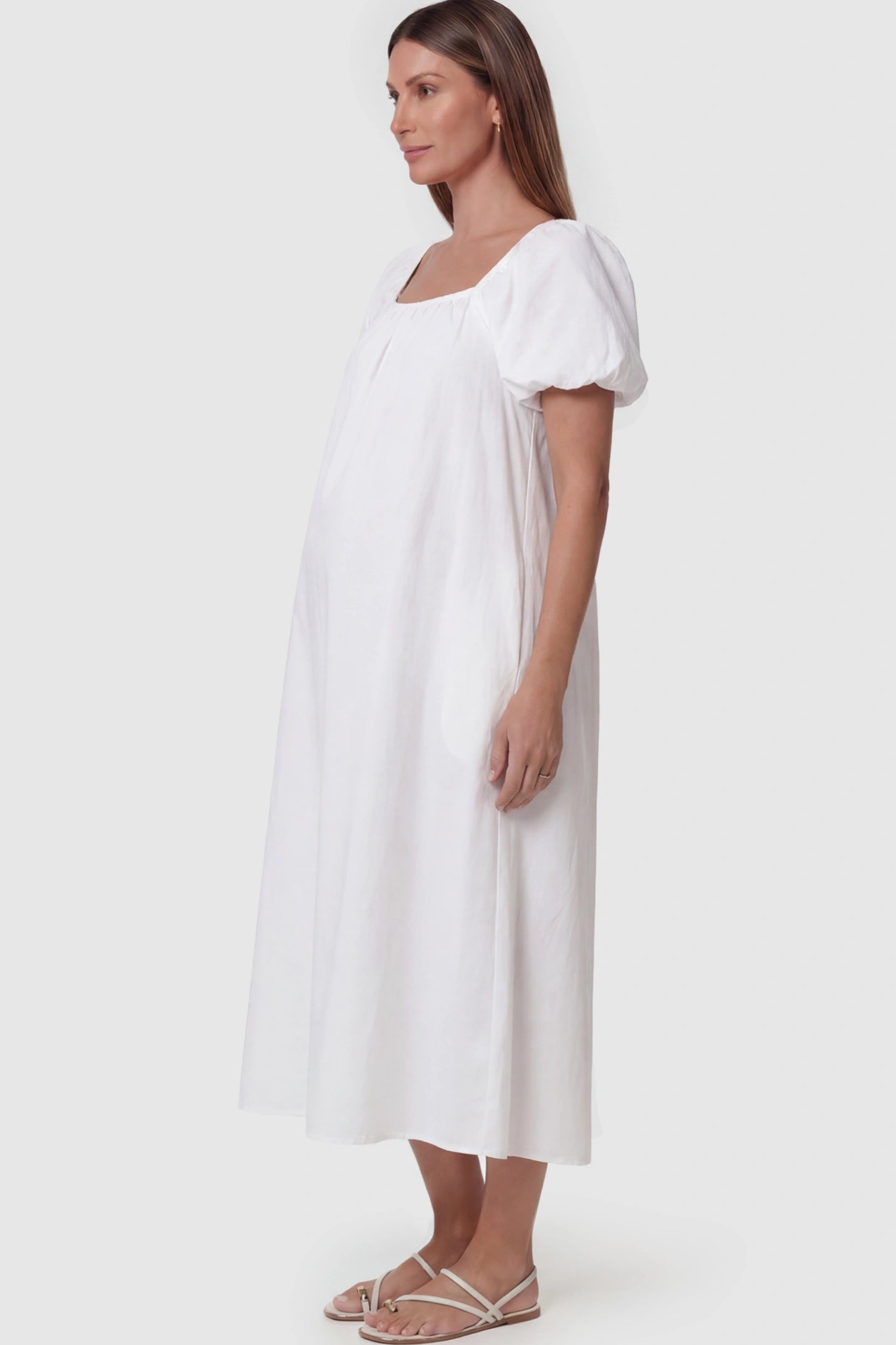 Puff Sleeve Square Neck Maternity Midi Dress Puff Sleeve Square Neck Midi Maternity Dress in White featuring a breathable cotton blend on a pregnant model.
