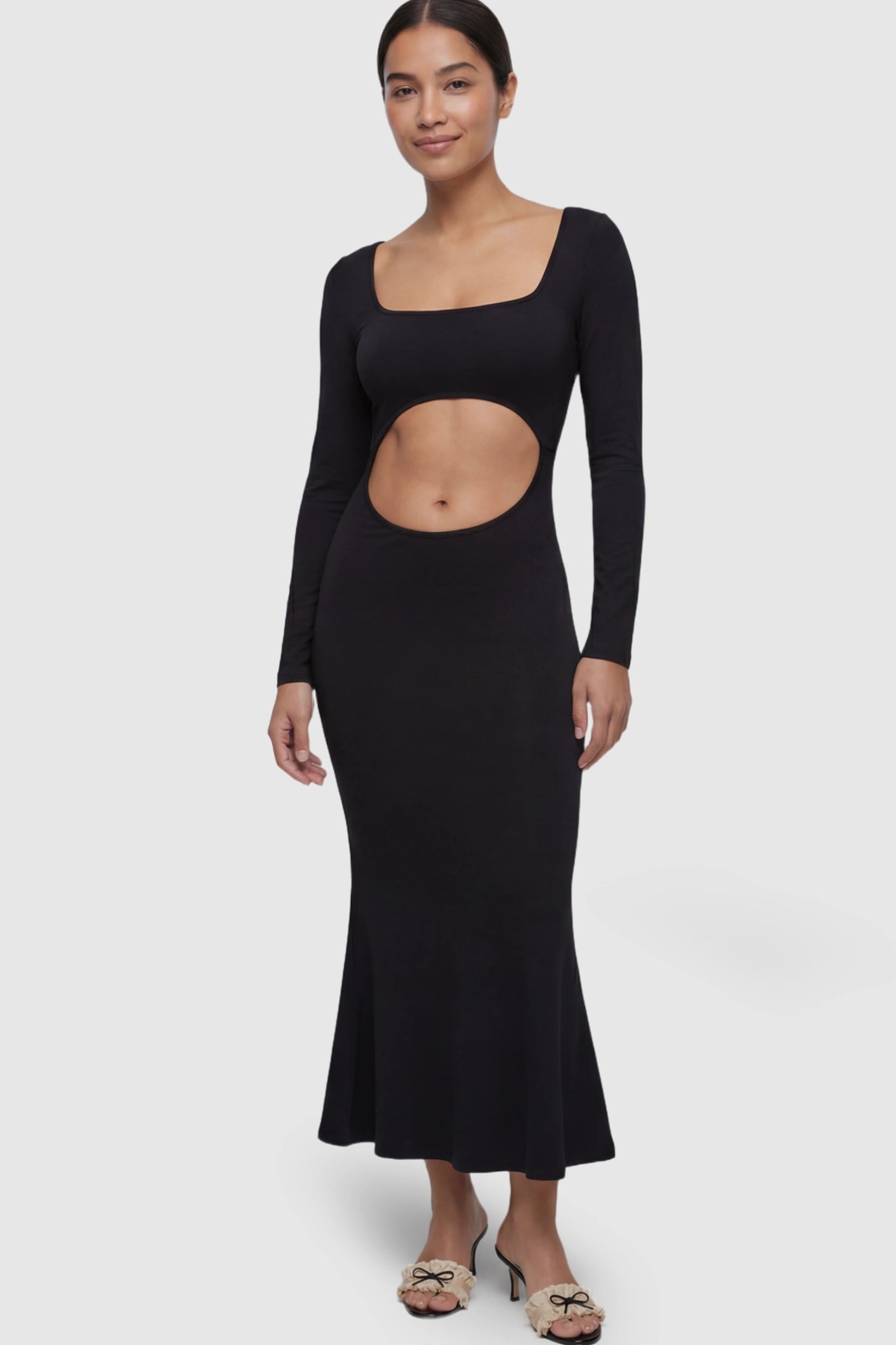 Solid Square Neck Long Sleeve Maternity Maxi Dress Solid Square Neck Long Sleeve Maternity Maxi Dress in black featuring a bold belly cut-out on a postpartum model.