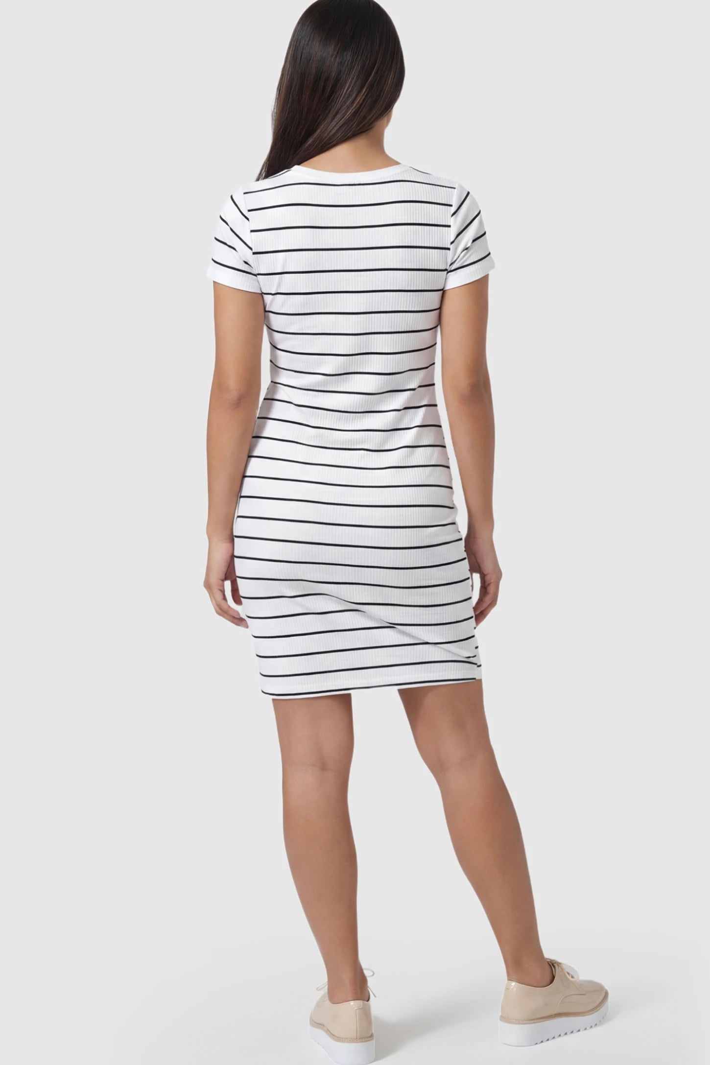 Striped Tie-Front Maternity Bodycon Dress Striped Tie-Front Maternity Bodycon Dress in white stripes on a pregnant model.