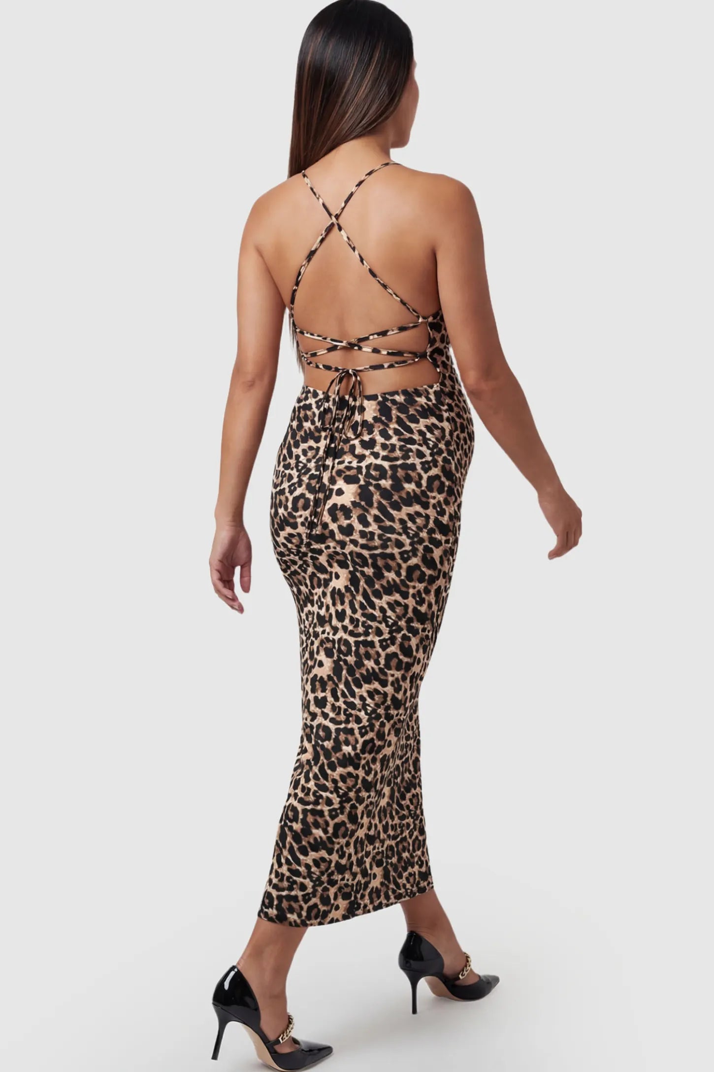 Leopard Print Spaghetti Strap Bodycon Maternity Maxi Dress Leopard Print Spaghetti Strap Bodycon Maternity Maxi Dress featuring a slim-fitting silhouette on a pregnant model.