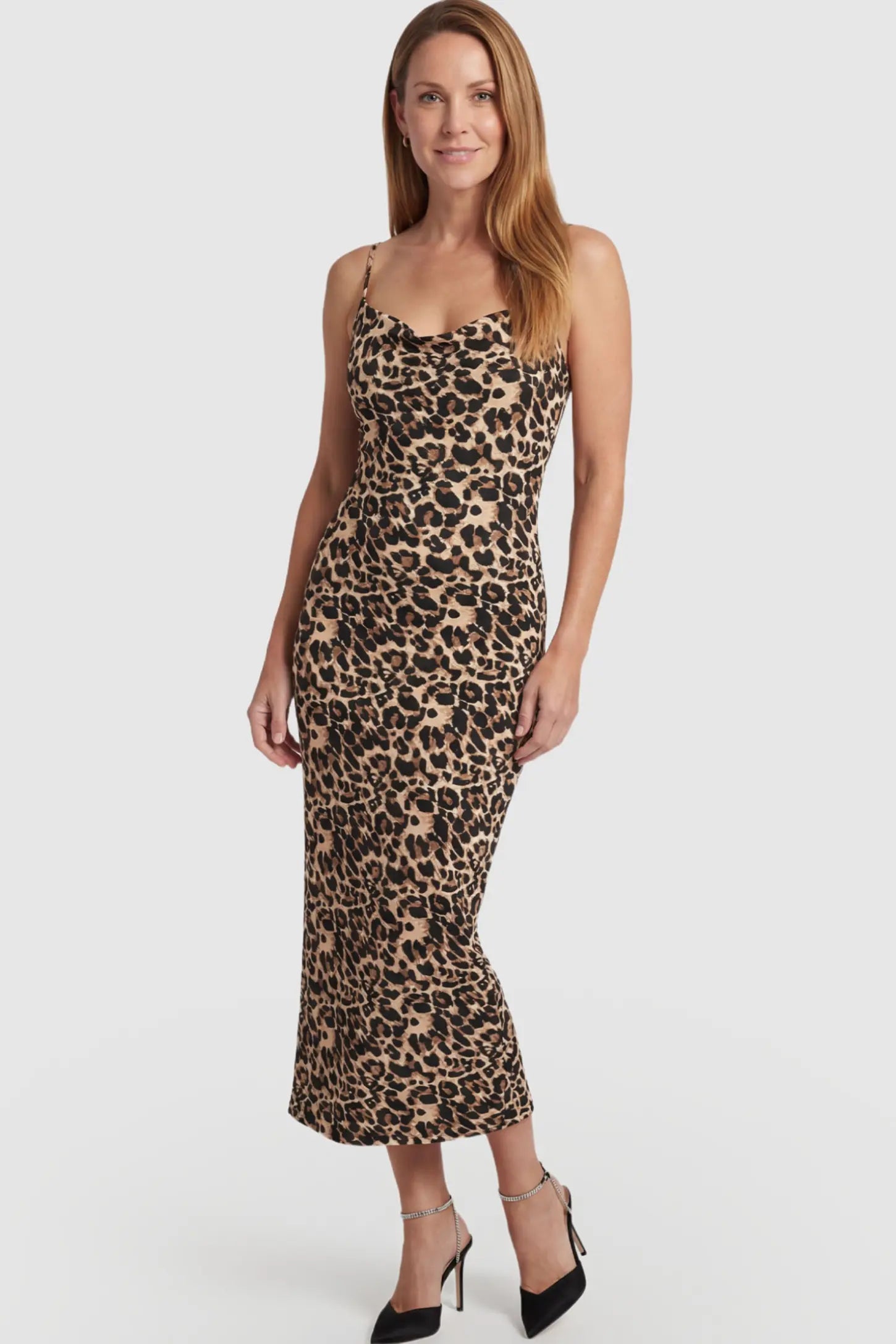 Leopard Print Spaghetti Strap Bodycon Maternity Maxi Dress Leopard Print Spaghetti Strap Bodycon Maternity Maxi Dress featuring a slim-fitting silhouette on a postpartum model.