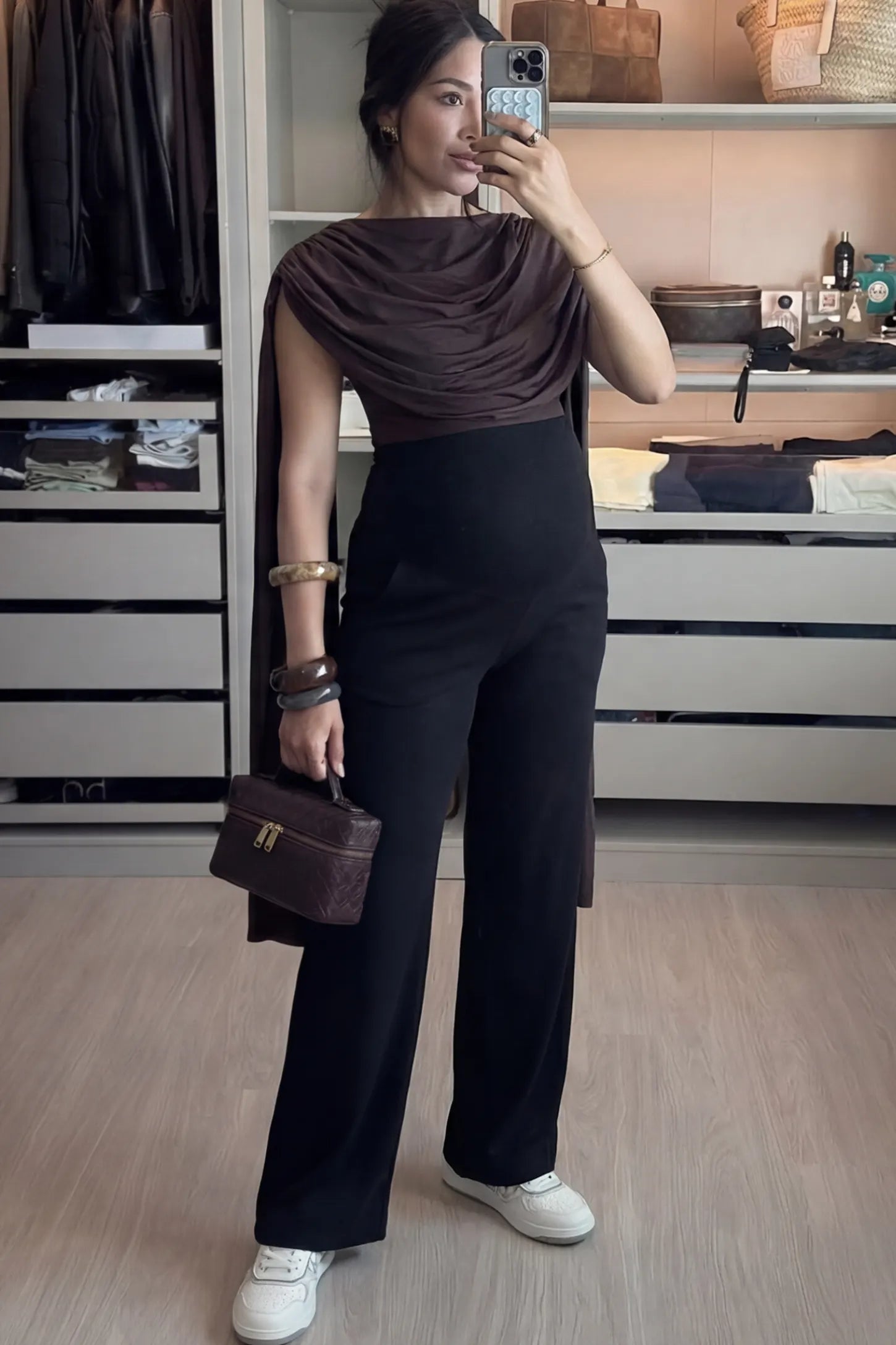 Fold-Over Waistband Wide Leg Maternity Pants Fold-Over Waistband Wide Leg Maternity Pants in Black featuring a versatile high-waist fit on a pregnant woman facing front.