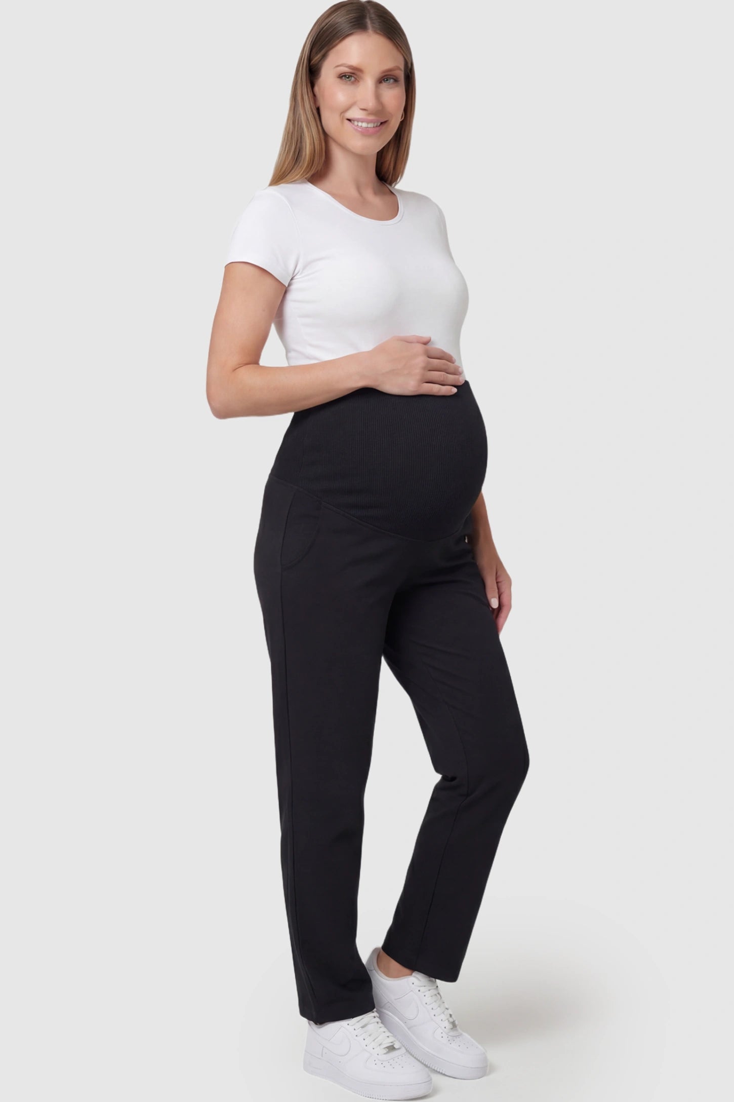 Elastic Mid Waist Straight Leg Maternity Pants in black featuring Elastic Waistband on a pregnant model.