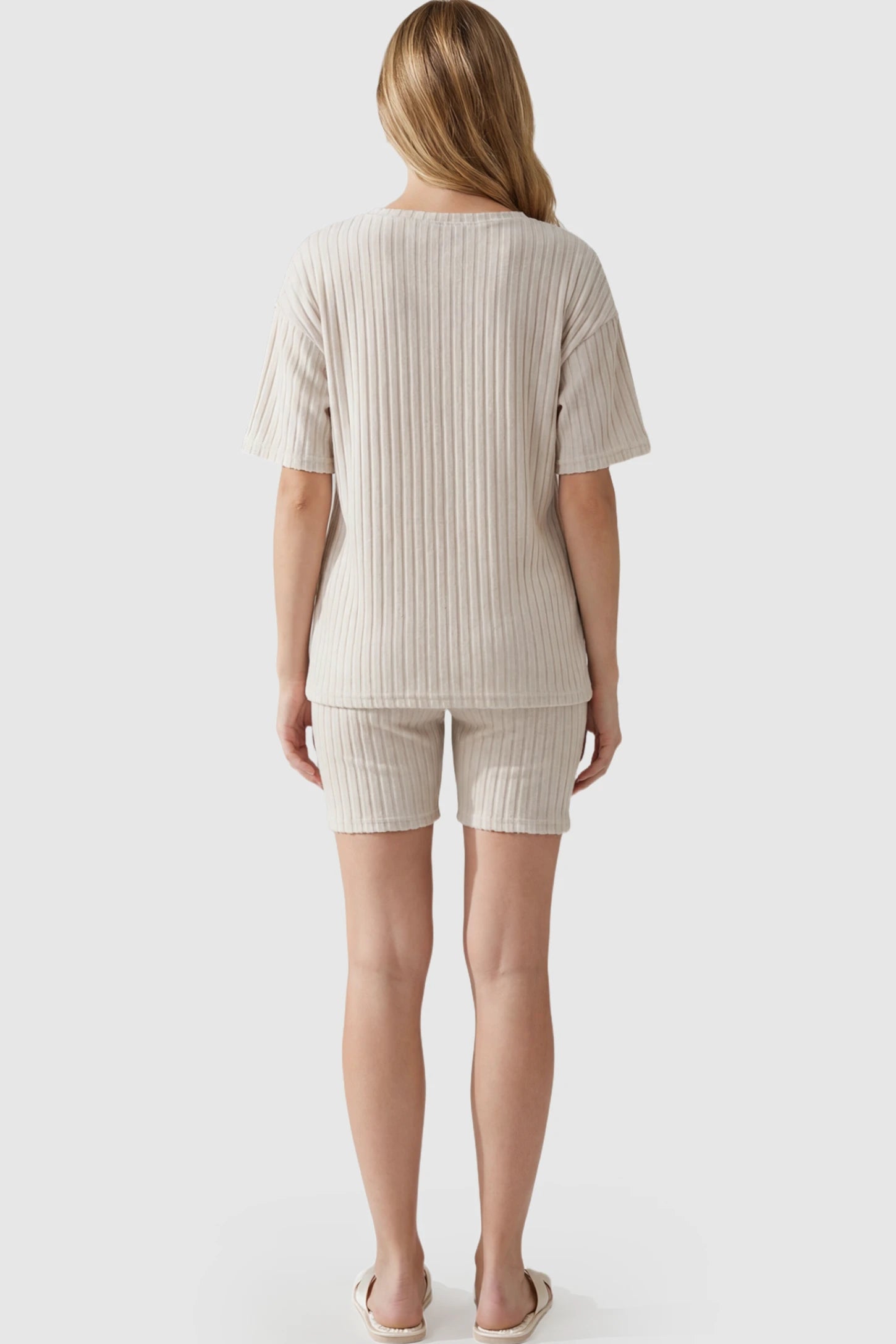 Ribbed Short Sleeve Top Biker Shorts Maternity Lounge Set Ribbed Vertical Stripe Maternity Loungewear Set in White With pinstripes on a pregnant model.