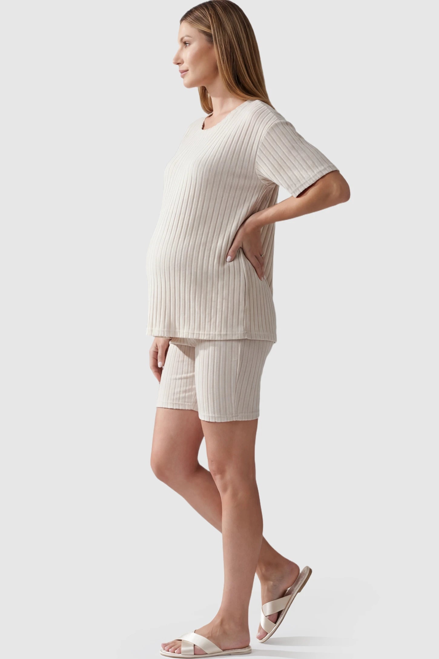 Ribbed Vertical Stripe Maternity Loungewear Set in White With pinstripes featuring a high-rise waistband on a pregnant model.