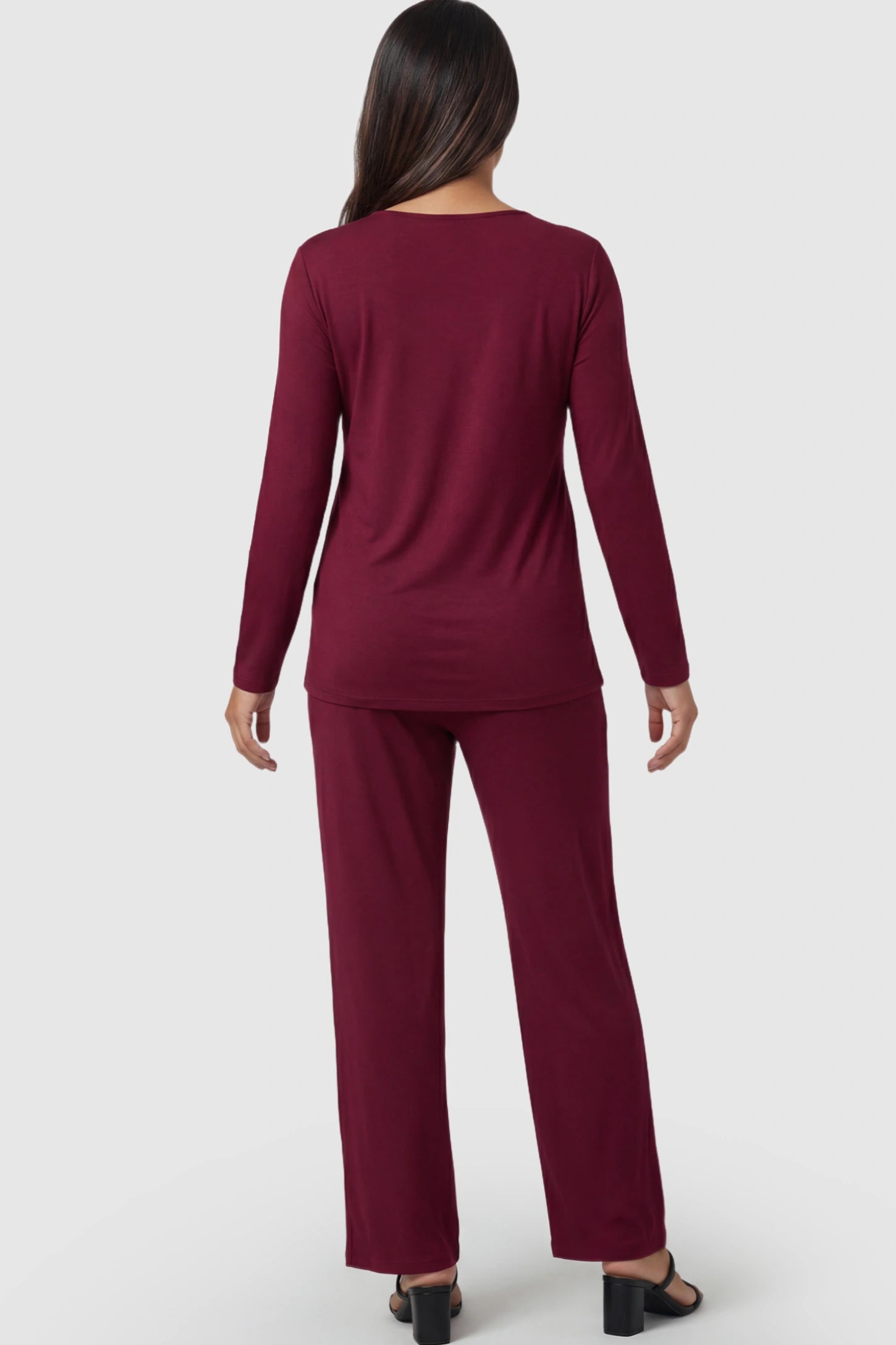 V-Neck Long Sleeve Top with Long Pants Maternity Lounge Set V-Neck Long Sleeve Maternity Lounge Set in Burgundy on a pregnant model.