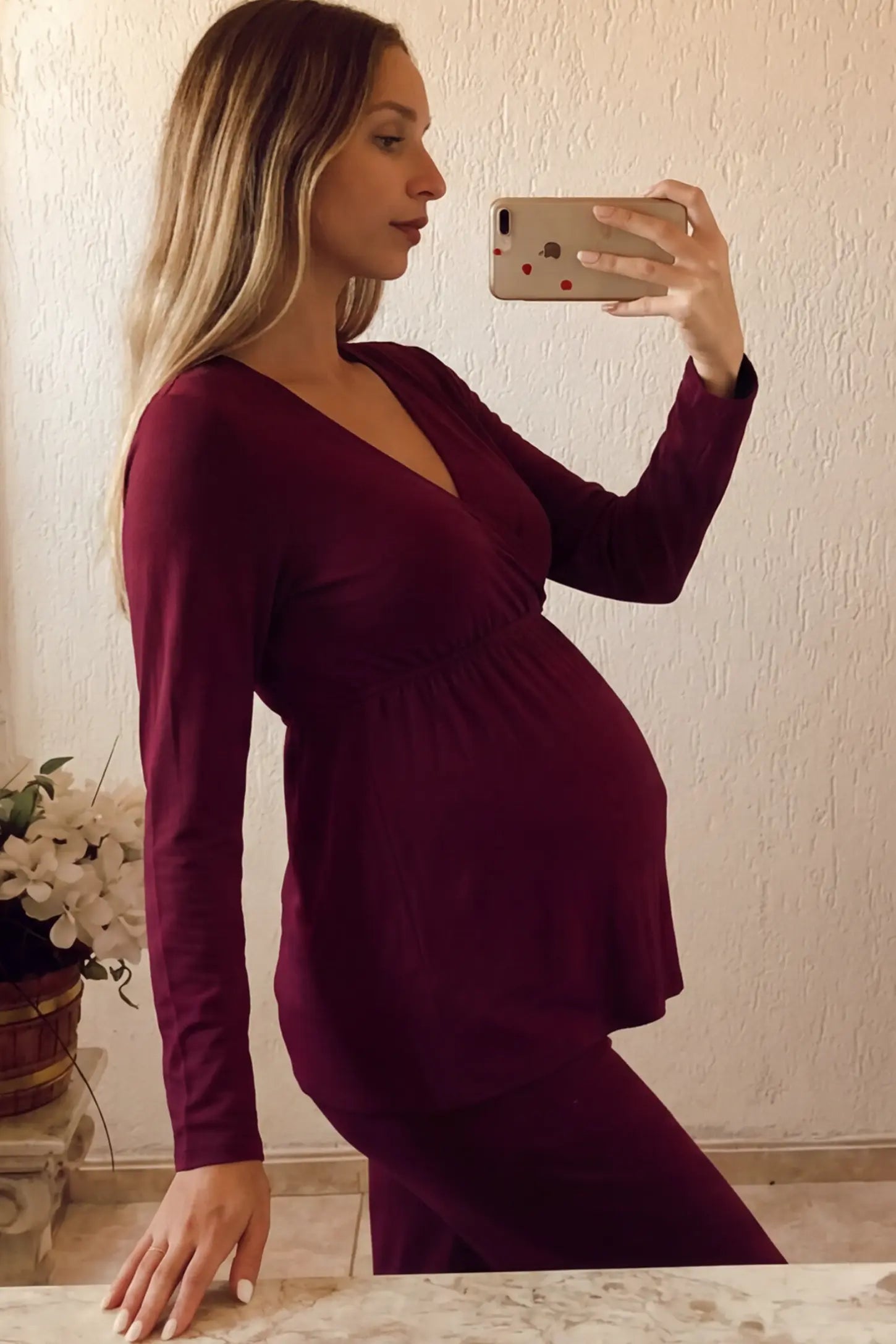 V-Neck Long Sleeve Top with Long Pants Maternity Lounge Set V-Neck Long Sleeve Maternity Lounge Set in Burgundy featuring a crossover front on a pregnant model.