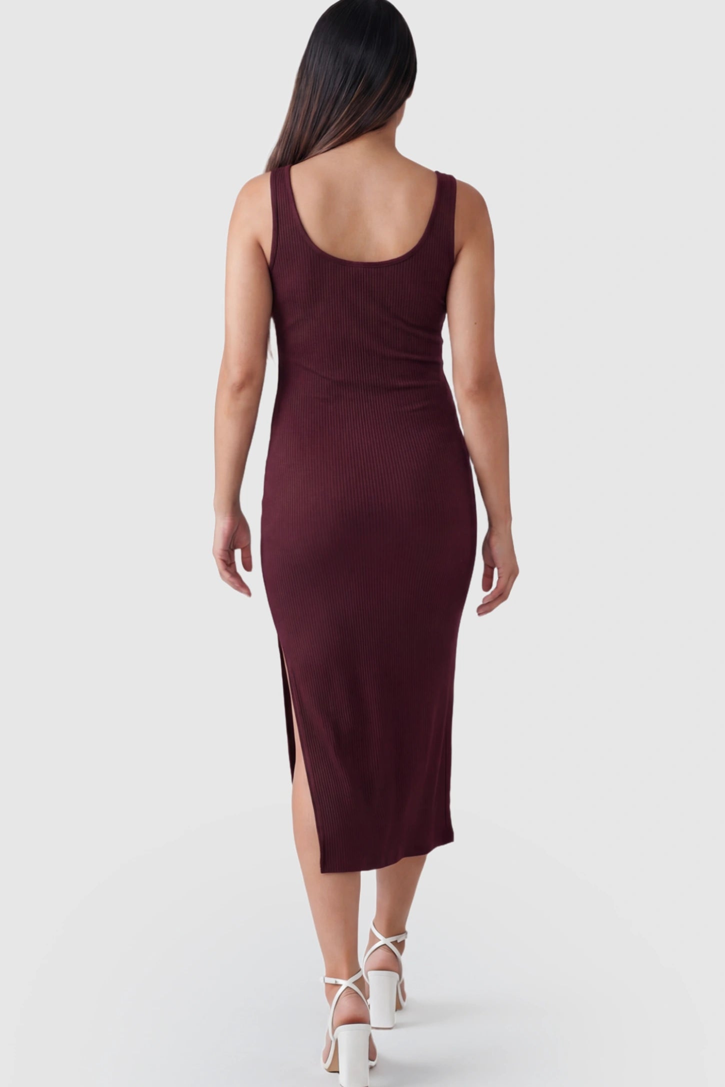 Ribbed Button Accent Side Slit Maternity Midi Dress Ribbed Button Accent Side Slit Maternity Midi Dress in Burgundy featuring a flexible knit on a pregnant model.