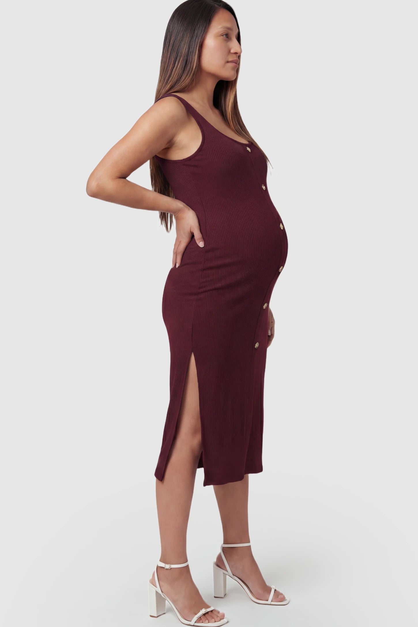 Ribbed Button Accent Side Slit Maternity Midi Dress in Burgundy featuring a flexible knit and decorative buttons on a pregnant model.