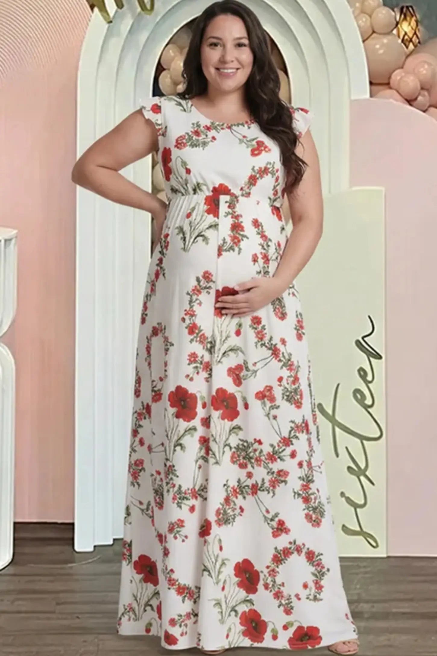 Floral Print Scoop Neck Maternity Maxi Dress Floral Print Scoop Neck Maxi Maternity Dress in White with Red Poppy Prints featuring ruffle sleeves on a pregnant model.