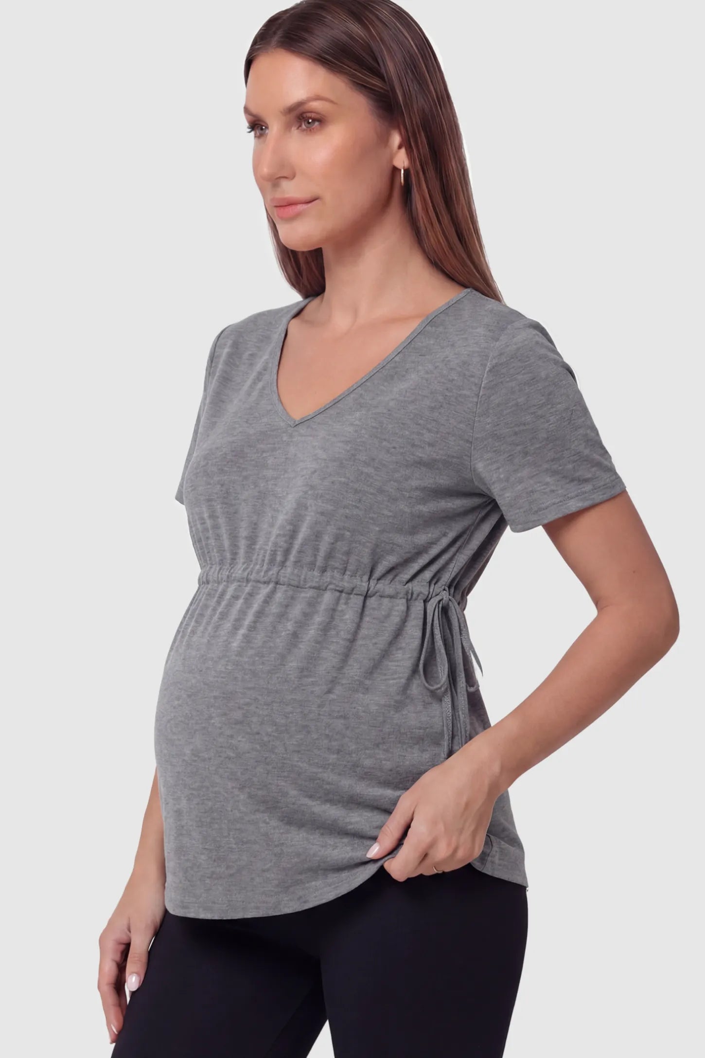 Cinched Waist Short Sleeve Maternity Tunic Top Cinched Waist Short Sleeve Maternity Tunic in Gray featuring a lightweight, stretchy fabric on a pregnant model in side view.