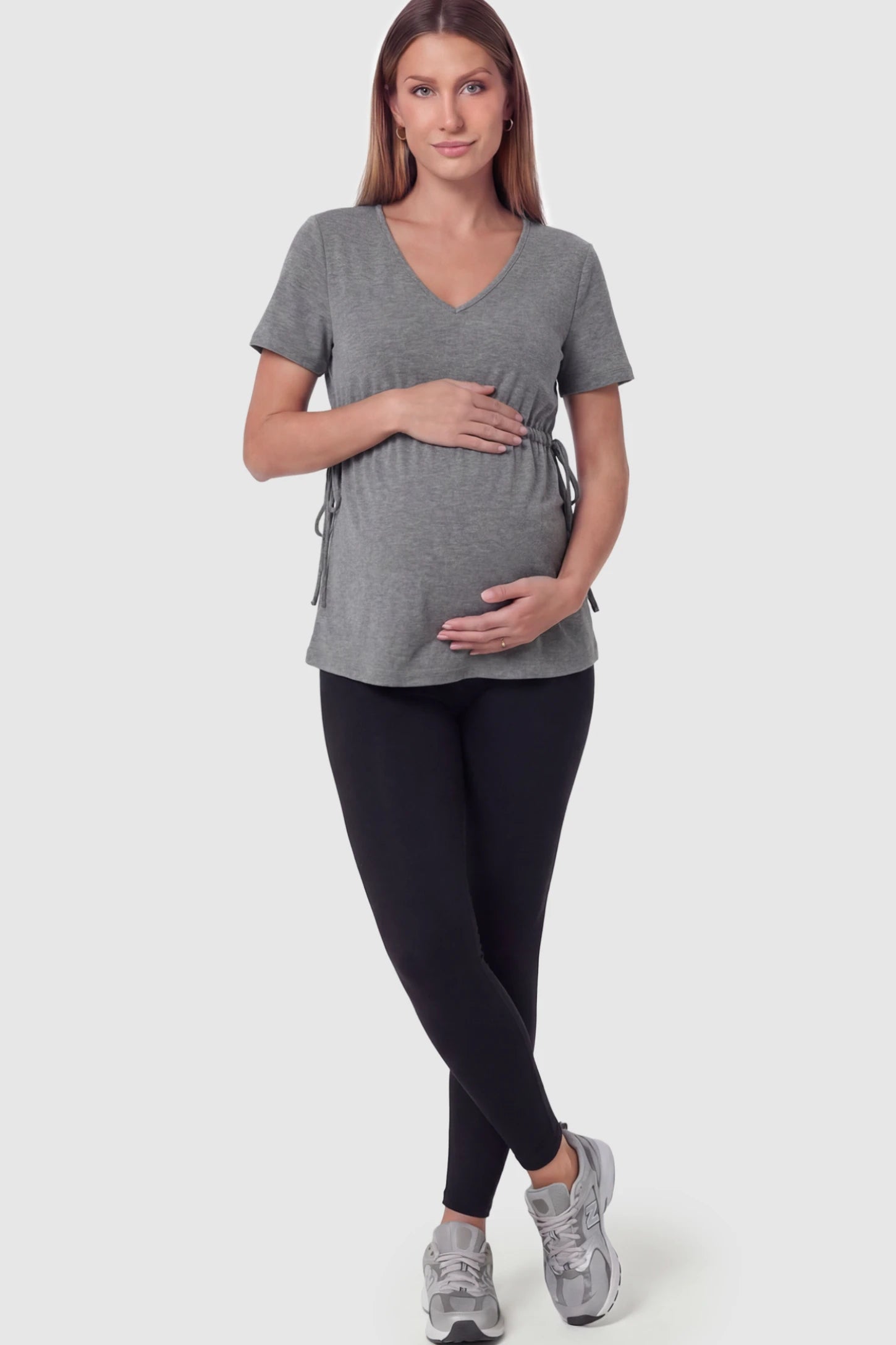Cinched Waist Short Sleeve Maternity Tunic Top Cinched Waist Short Sleeve Maternity Tunic in Gray featuring a lightweight, stretchy fabric on a pregnant model in full body shot.