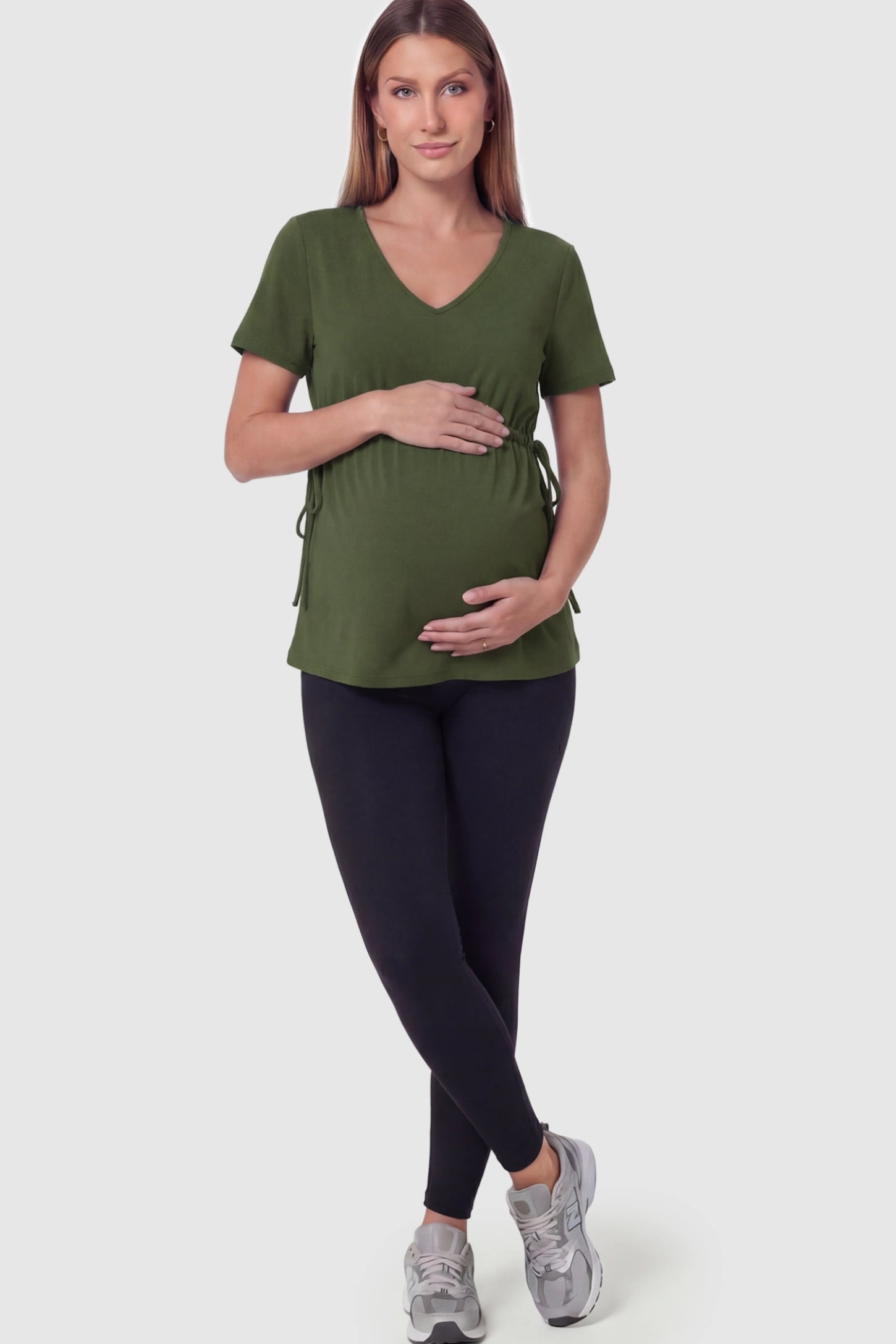 Cinched Waist Short Sleeve Maternity Tunic Top Cinched Waist Short Sleeve Maternity Tunic in Military Green featuring a curved silhouette on a pregnant model in full body shoot.