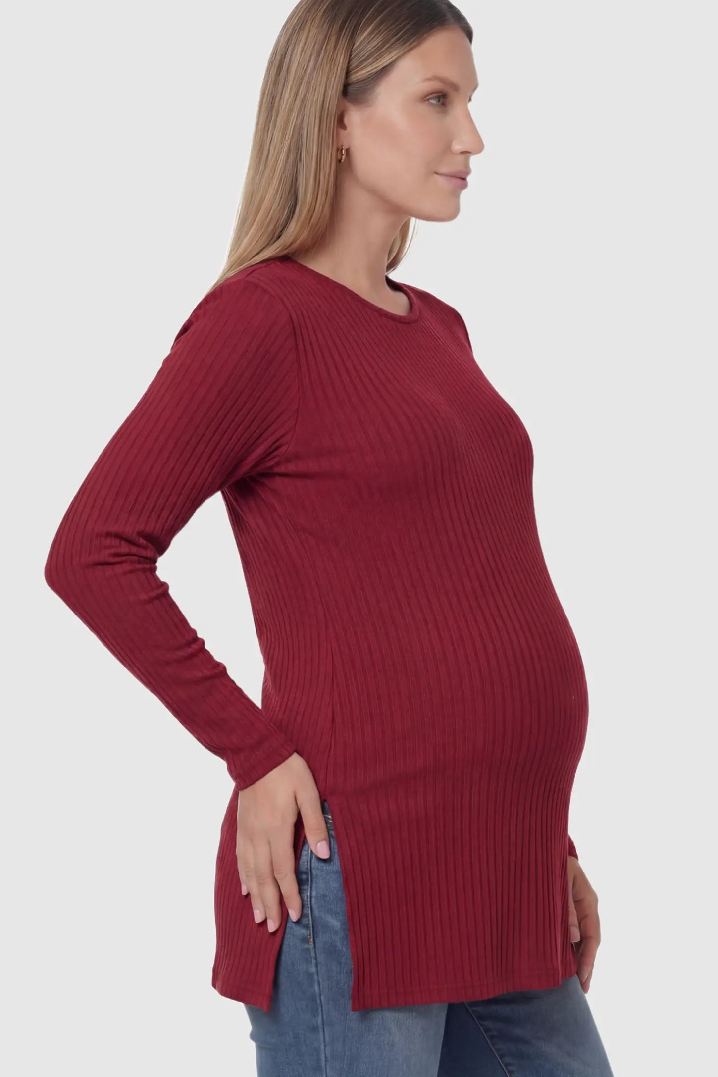 Ribbed Knit Long Sleeve Side Slit Maternity Top Ribbed Knit Side Slit Maternity Top in Burgundy featuring high-stretch fabric and tunic length on a pregnant model.