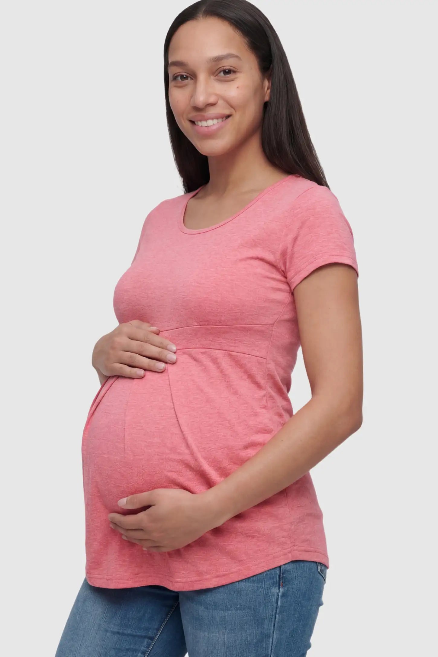 Pleated Heathered Short Sleeve Maternity Top in Pink featuring an empire waist on a pregnant model.