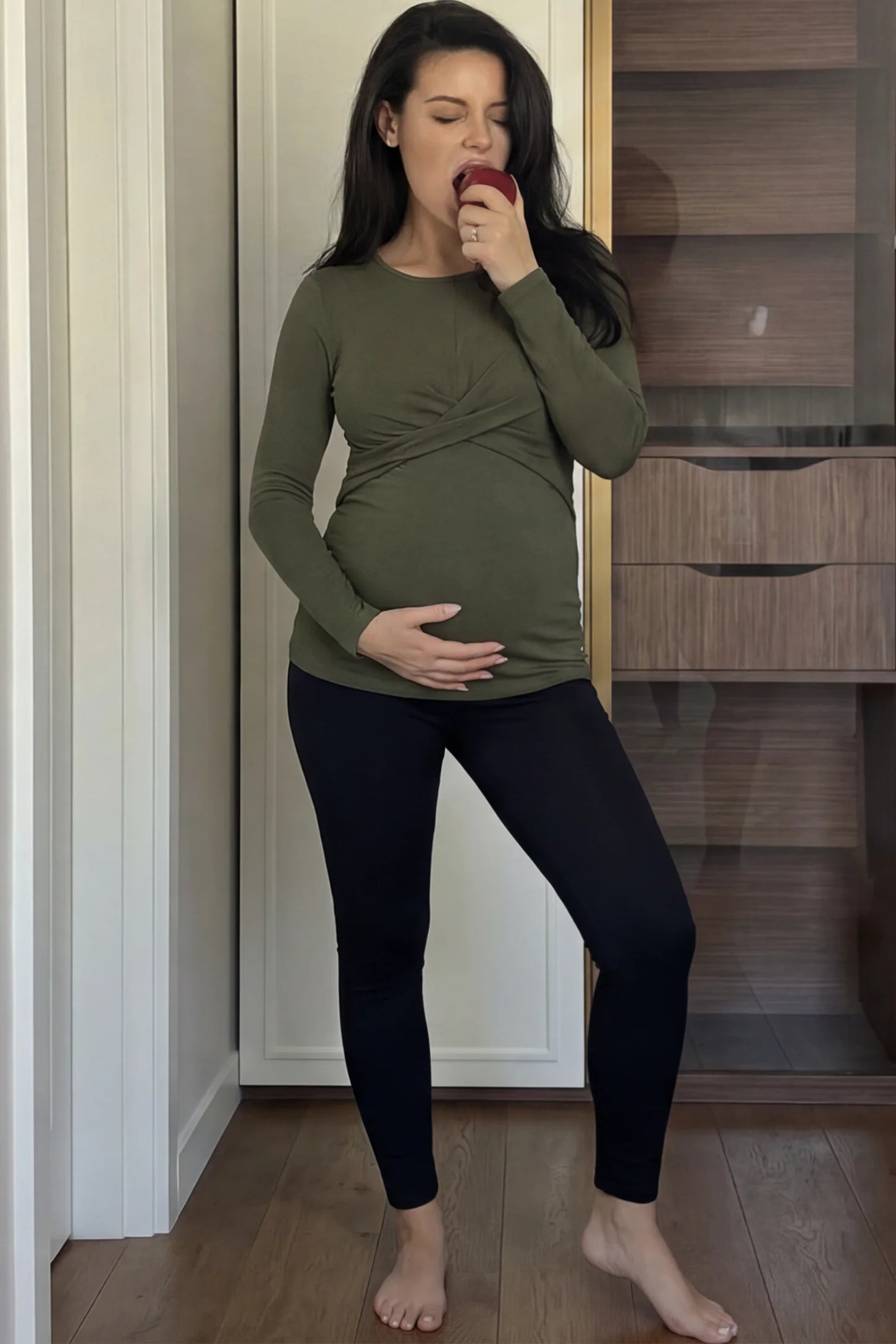 Cross Front Long Sleeve Maternity Top Cross Front Long Sleeve Maternity Top in Olive Green featuring a crossover waist detail on a pregnant model.