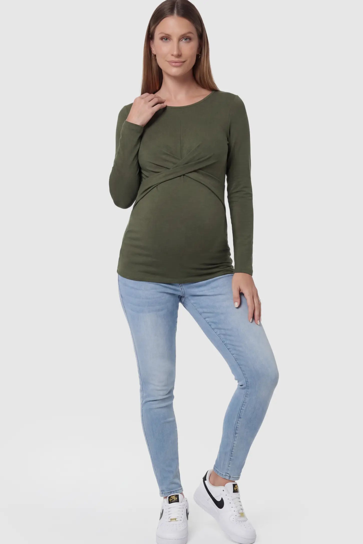 Cross Front Long Sleeve Maternity Top Cross Front Long Sleeve Maternity Top in Olive Green featuring a crossover waist detail on a pregnant model.