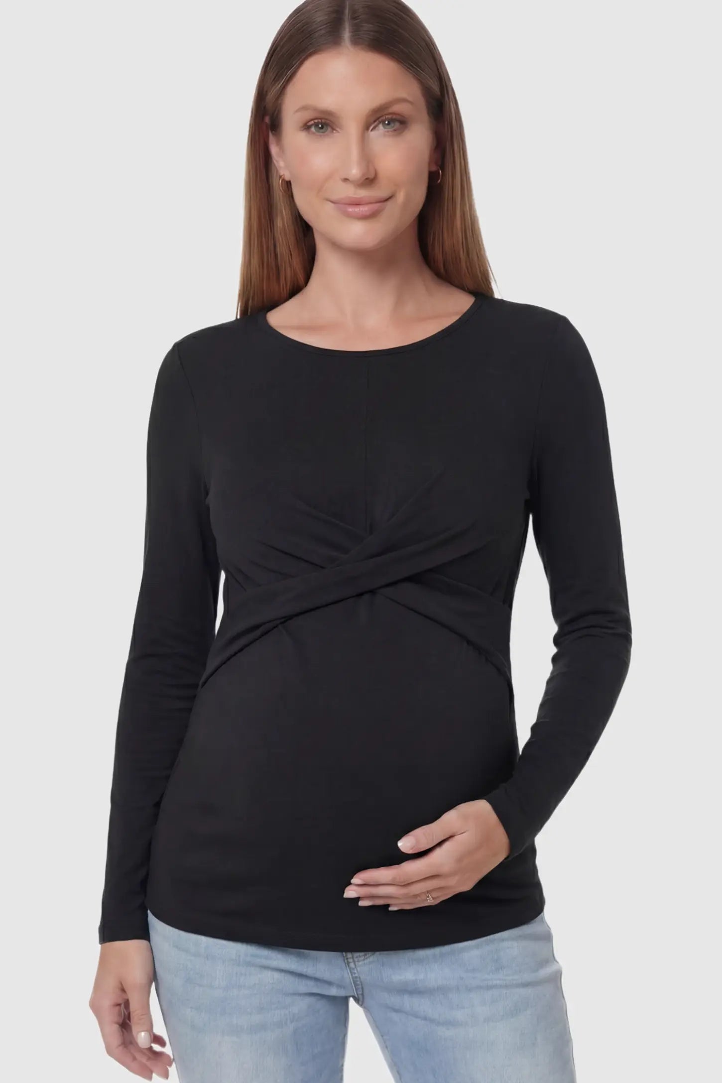 Cross Front Long Sleeve Maternity Top Cross Front Long Sleeve Maternity Top in Black featuring a crossover waist detail on a pregnant model.