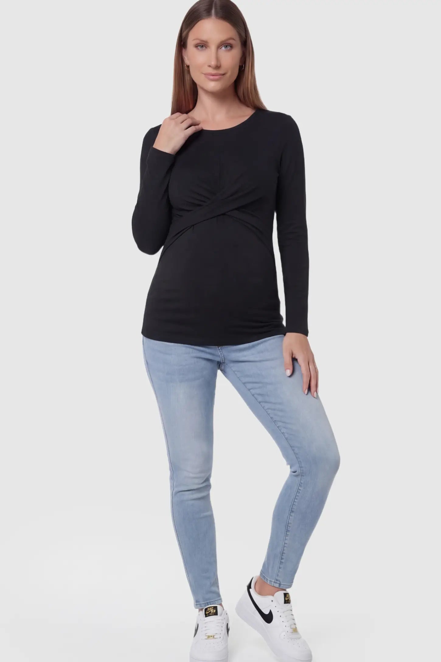 Cross Front Long Sleeve Maternity Top Cross Front Long Sleeve Maternity Top in Black featuring a crossover waist detail on a pregnant model.