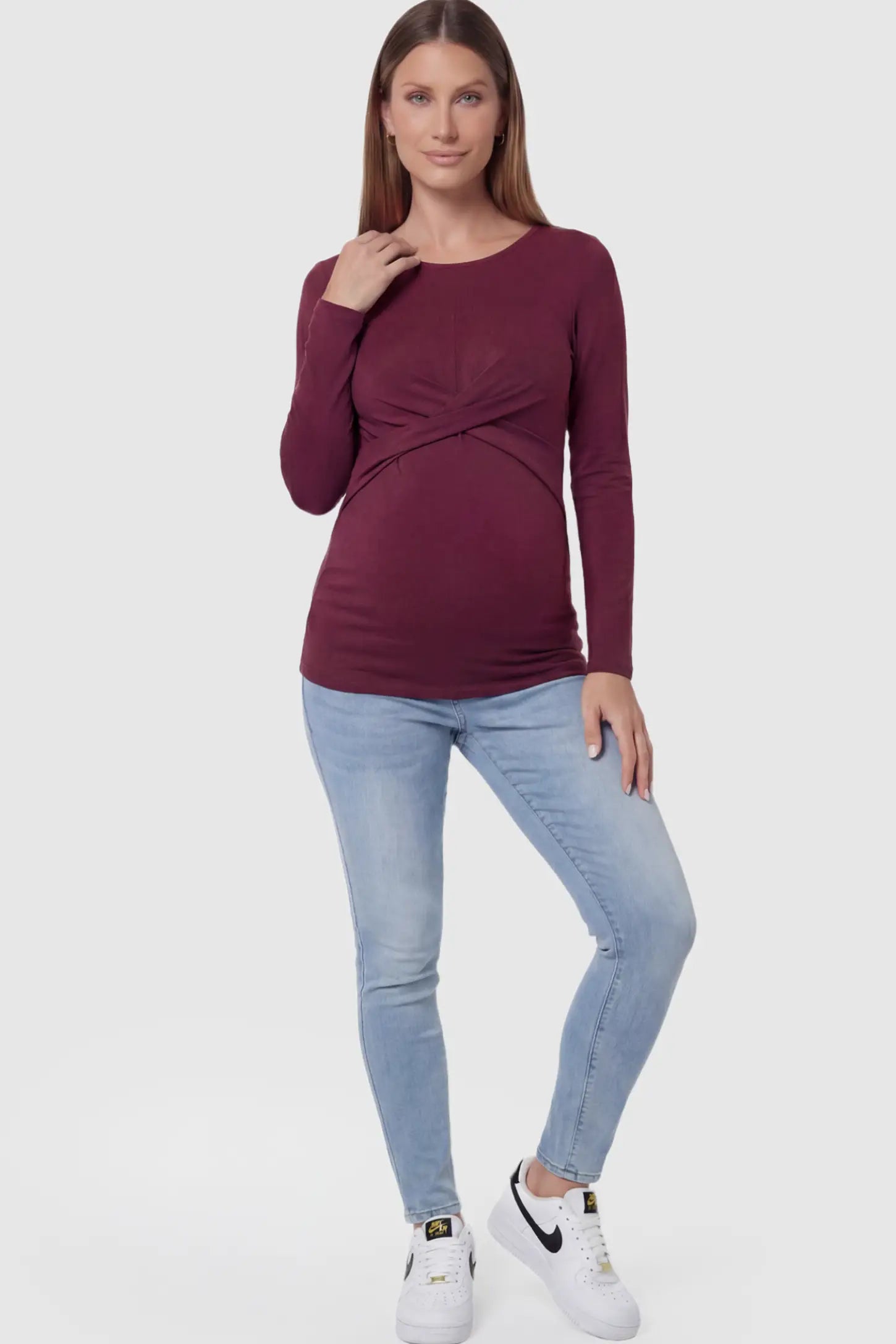 Cross Front Long Sleeve Maternity Top Cross Front Long Sleeve Maternity Top in Dark Purple featuring a crossover waist detail on a pregnant model.