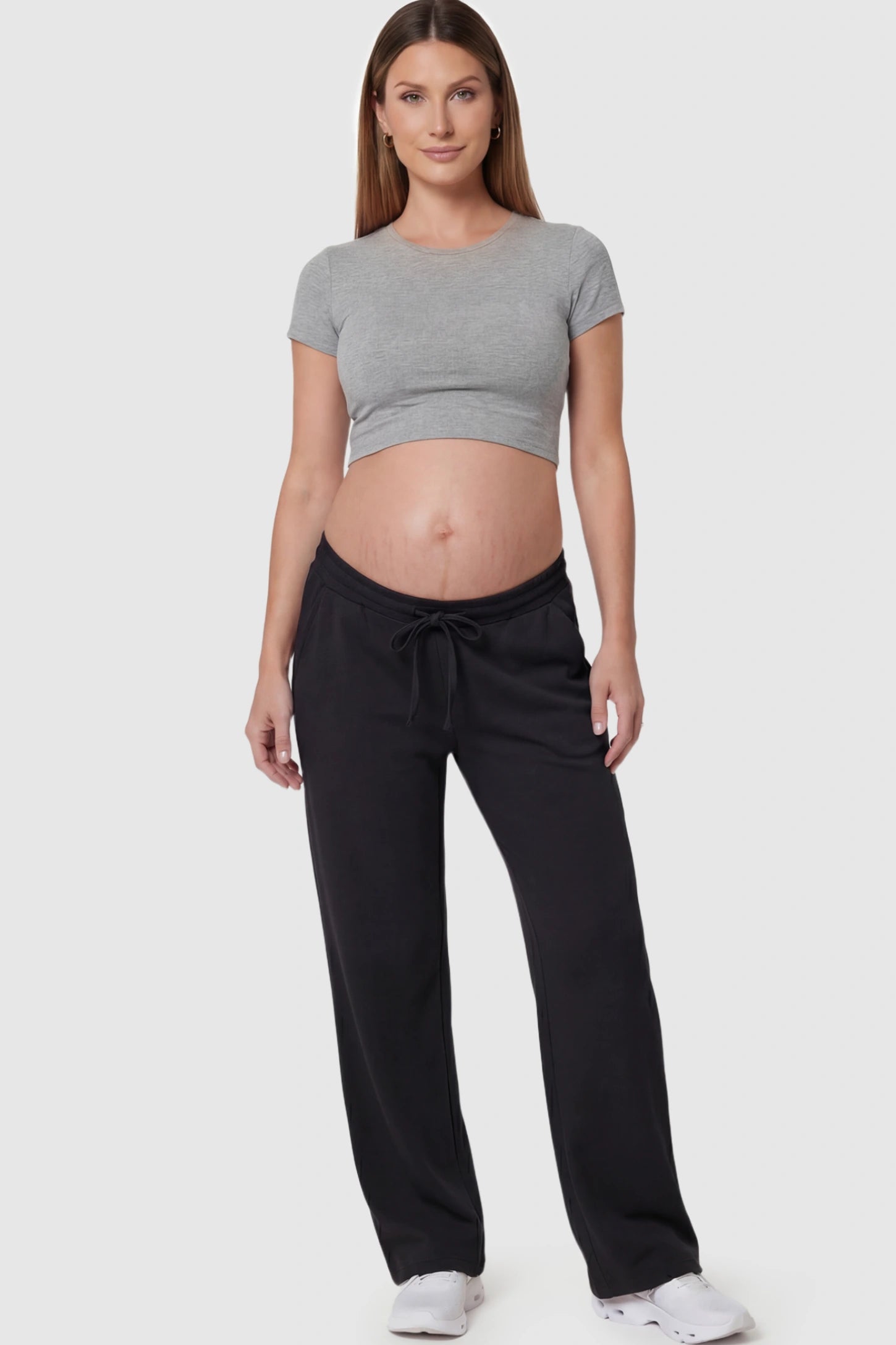 Drawstring Waffle Knit Wide Leg Maternity Lounge Pants Drawstring Waffle Knit Wide Leg Maternity Casual Pants in Black featuring an adjustable waistband on a pregnant model.