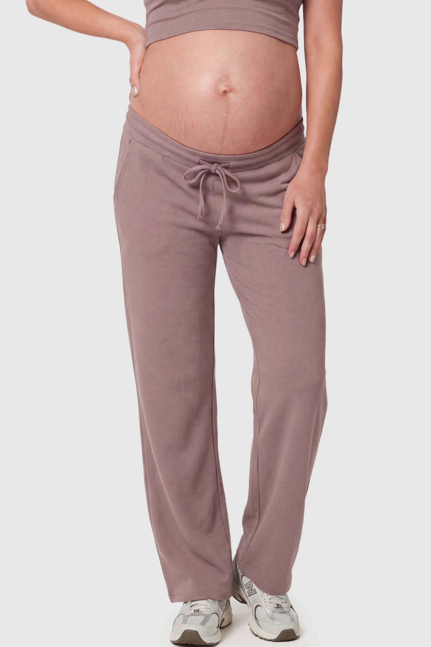 Drawstring Waffle Knit Wide Leg Maternity Lounge Pants Drawstring Waffle Knit Wide Leg Maternity Casual Pants in Brown featuring an adjustable waistband on a pregnant model.