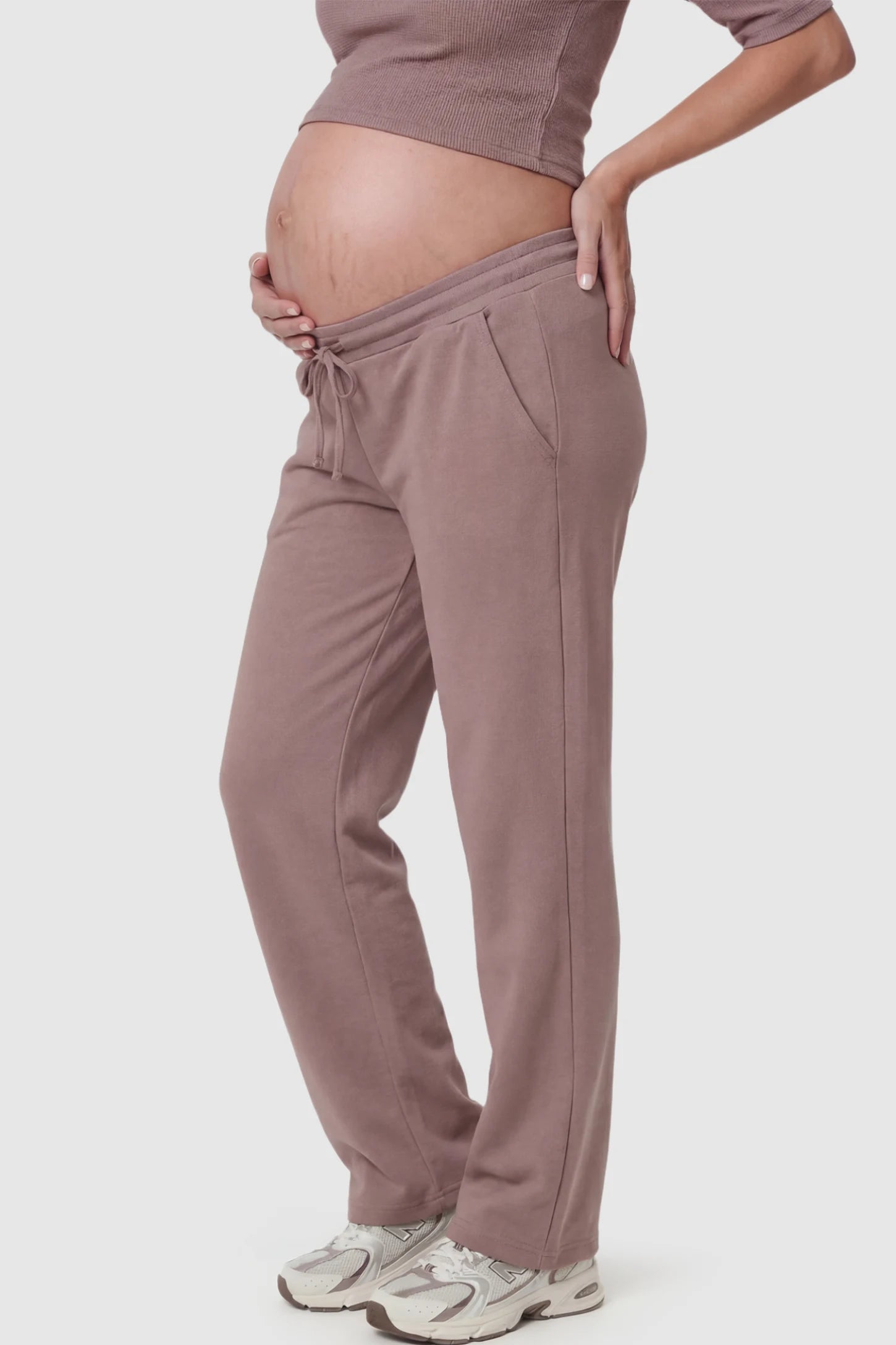 Drawstring Waffle Knit Wide Leg Maternity Lounge Pants Drawstring Waffle Knit Wide Leg Maternity Casual Pants in Brown featuring an adjustable waistband on a pregnant model.