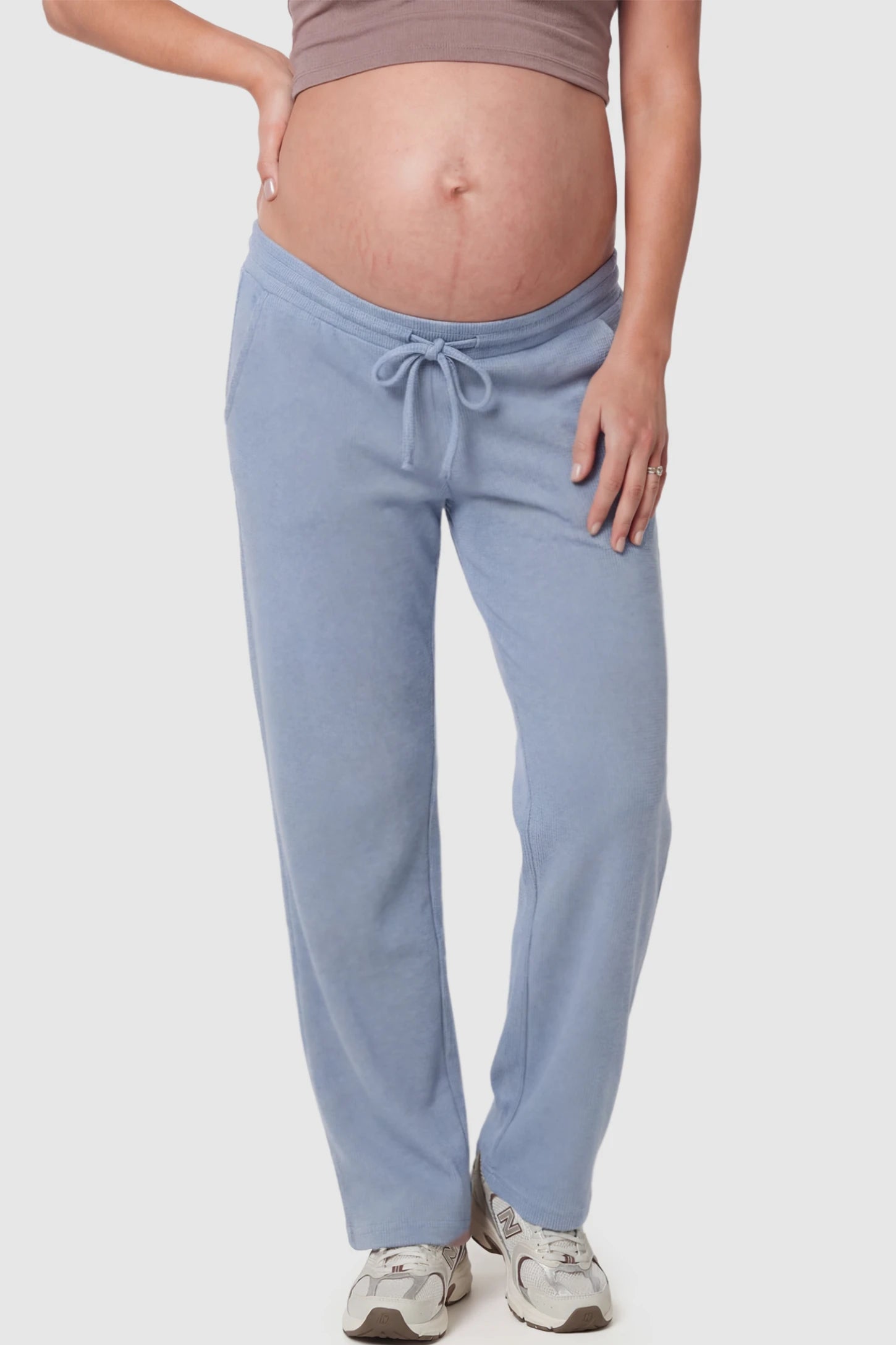 Drawstring Waffle Knit Wide Leg Maternity Lounge Pants Drawstring Waffle Knit Wide Leg Maternity Casual Pants in Blue featuring an adjustable waistband on a pregnant model.