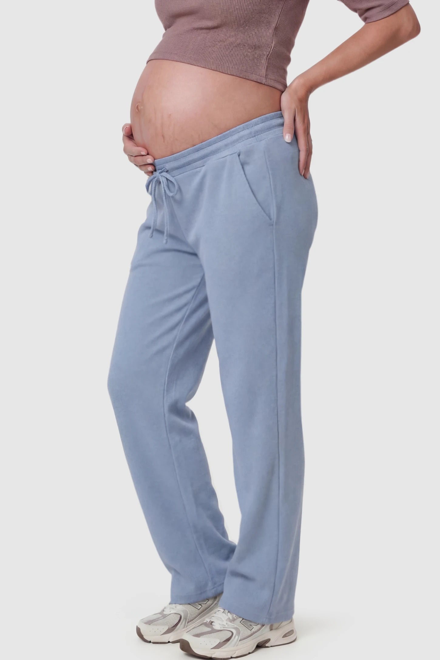Drawstring Waffle Knit Wide Leg Maternity Lounge Pants Drawstring Waffle Knit Wide Leg Maternity Casual Pants in Blue featuring an adjustable waistband on a pregnant model.