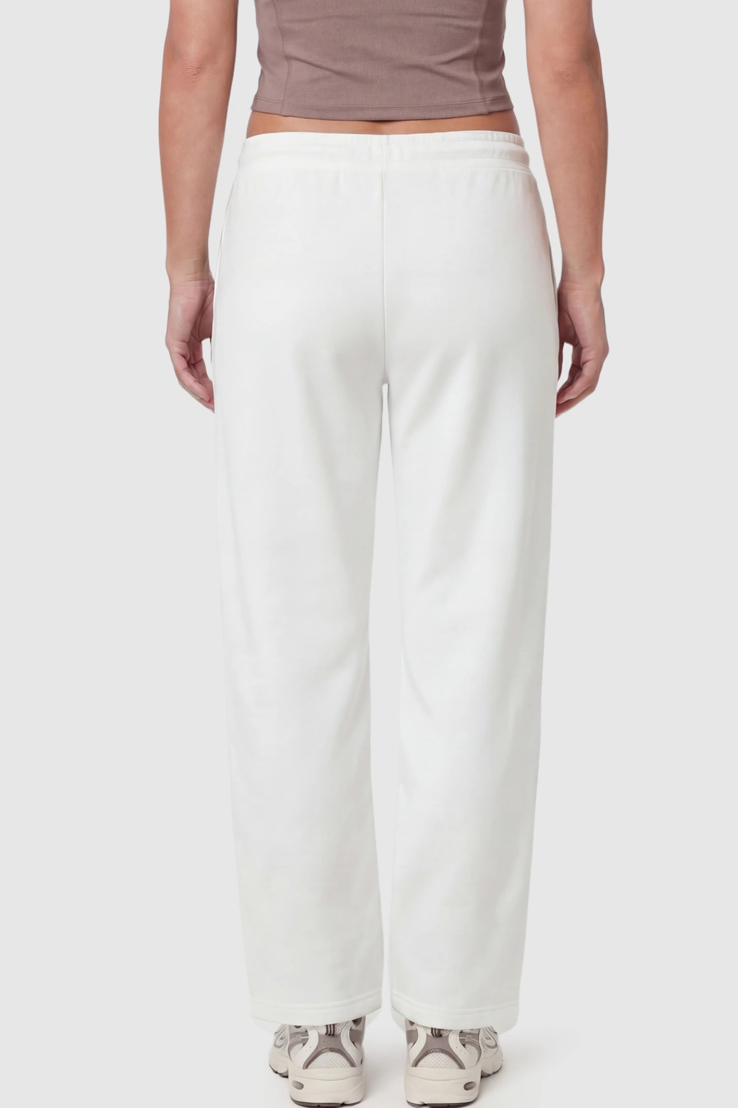 Drawstring Waffle Knit Wide Leg Maternity Lounge Pants Drawstring Waffle Knit Wide Leg Maternity Casual Pants in White featuring an adjustable waistband on a pregnant model.