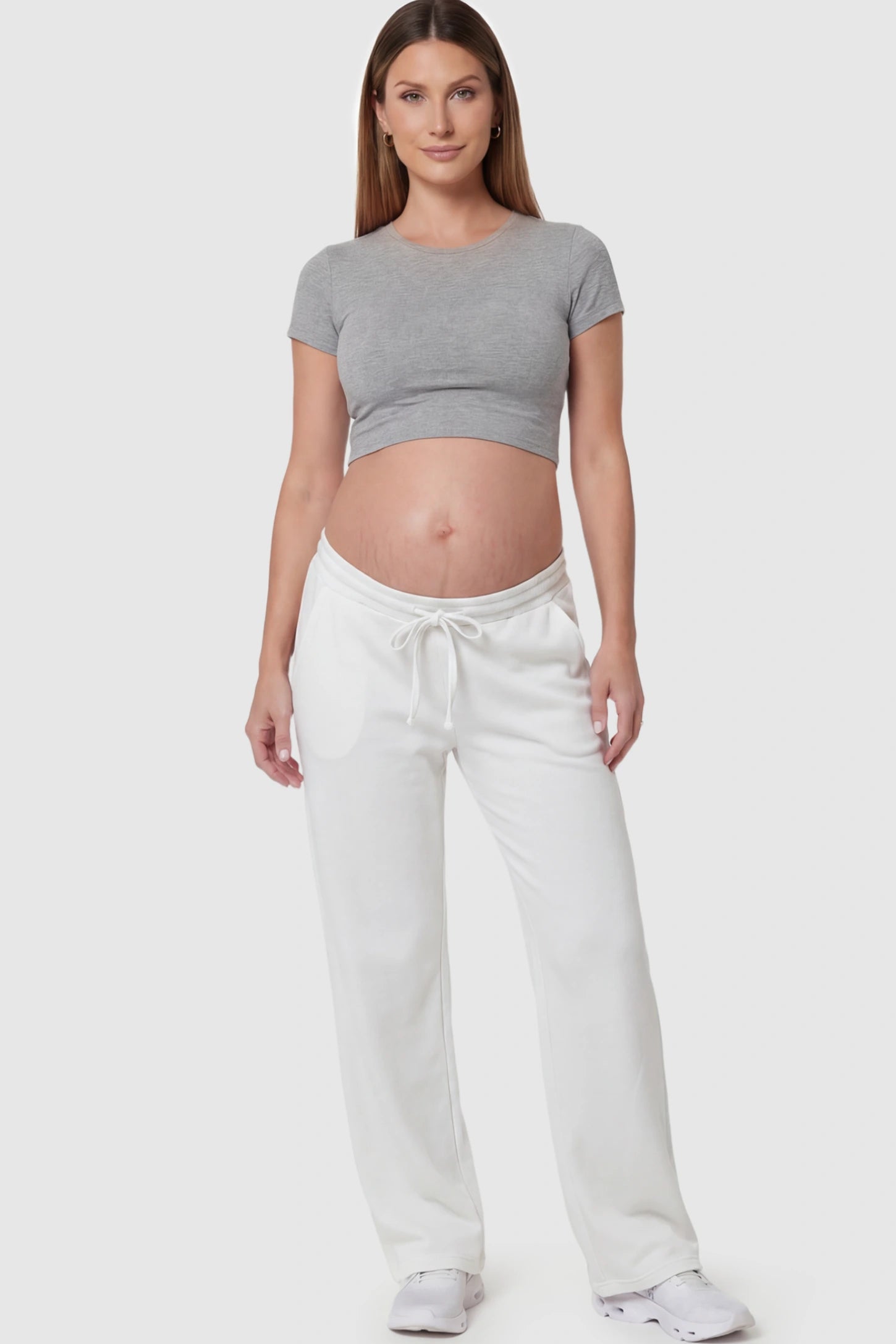Drawstring Waffle Knit Wide Leg Maternity Lounge Pants Drawstring Waffle Knit Wide Leg Maternity Casual Pants in White featuring an adjustable waistband on a pregnant model.