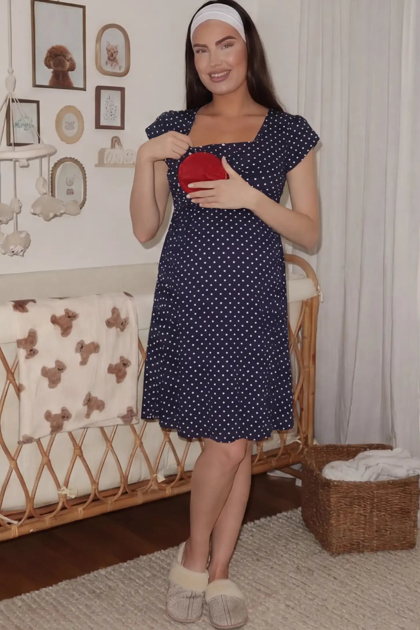 Polka Dot Scoop Neck Maternity Nursing Dress Polka Dot Scoop Neck Midi Maternity Nursing Dress in Navy blue featuring a discreet lift-up layer on a pregnant model.