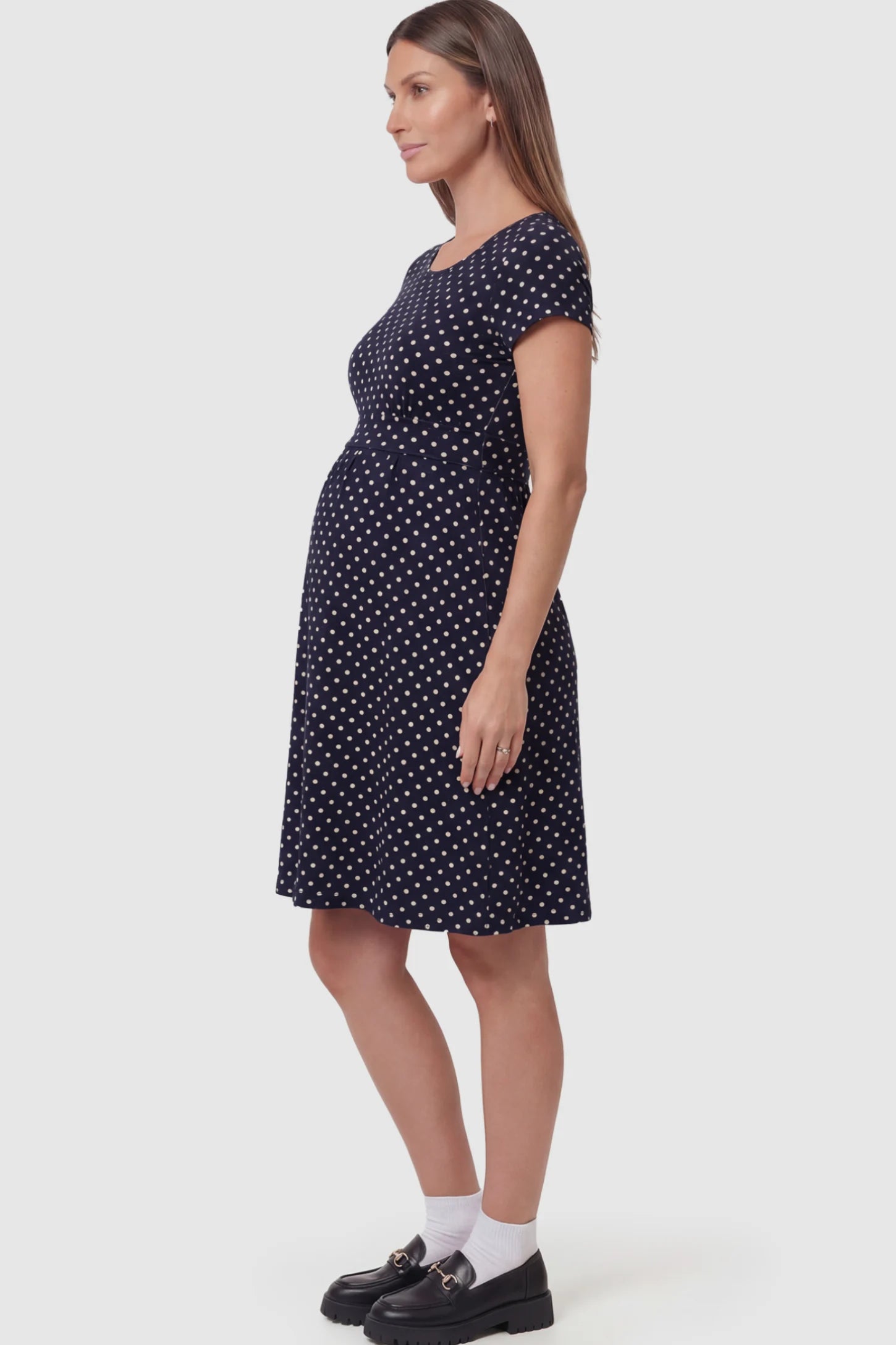 Polka Dot Scoop Neck Midi Maternity Nursing Dress in Navy blue featuring a discreet lift-up layer on a pregnant model.