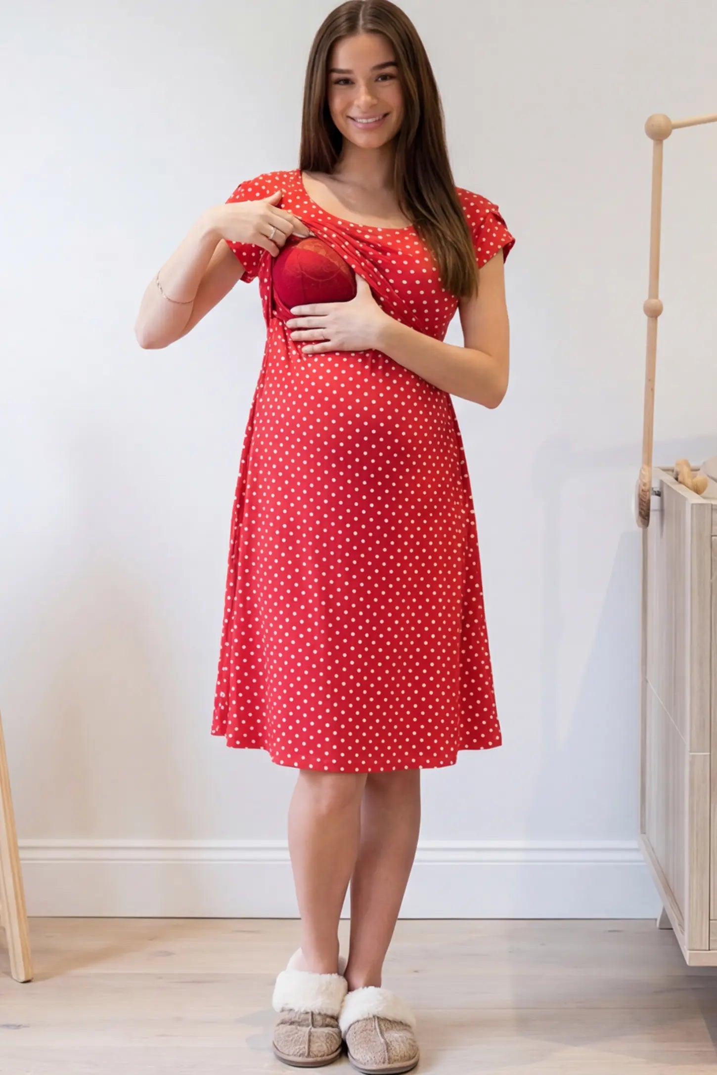 Polka Dot Scoop Neck Maternity Nursing Dress Polka Dot Scoop Neck Midi Maternity Nursing Dress in red featuring a discreet lift-up layer on a pregnant model.