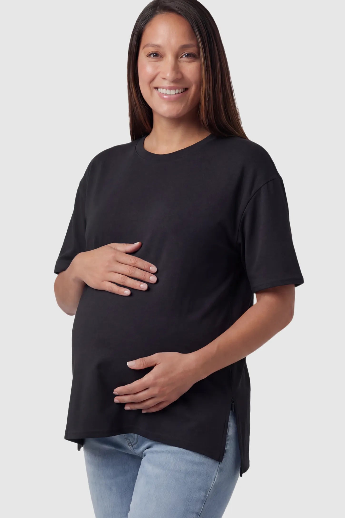 Maternity Side-Slit Crew Neck Short Sleeve in Black featuring an oversized wrinkle-resistant fit on a pregnant model.