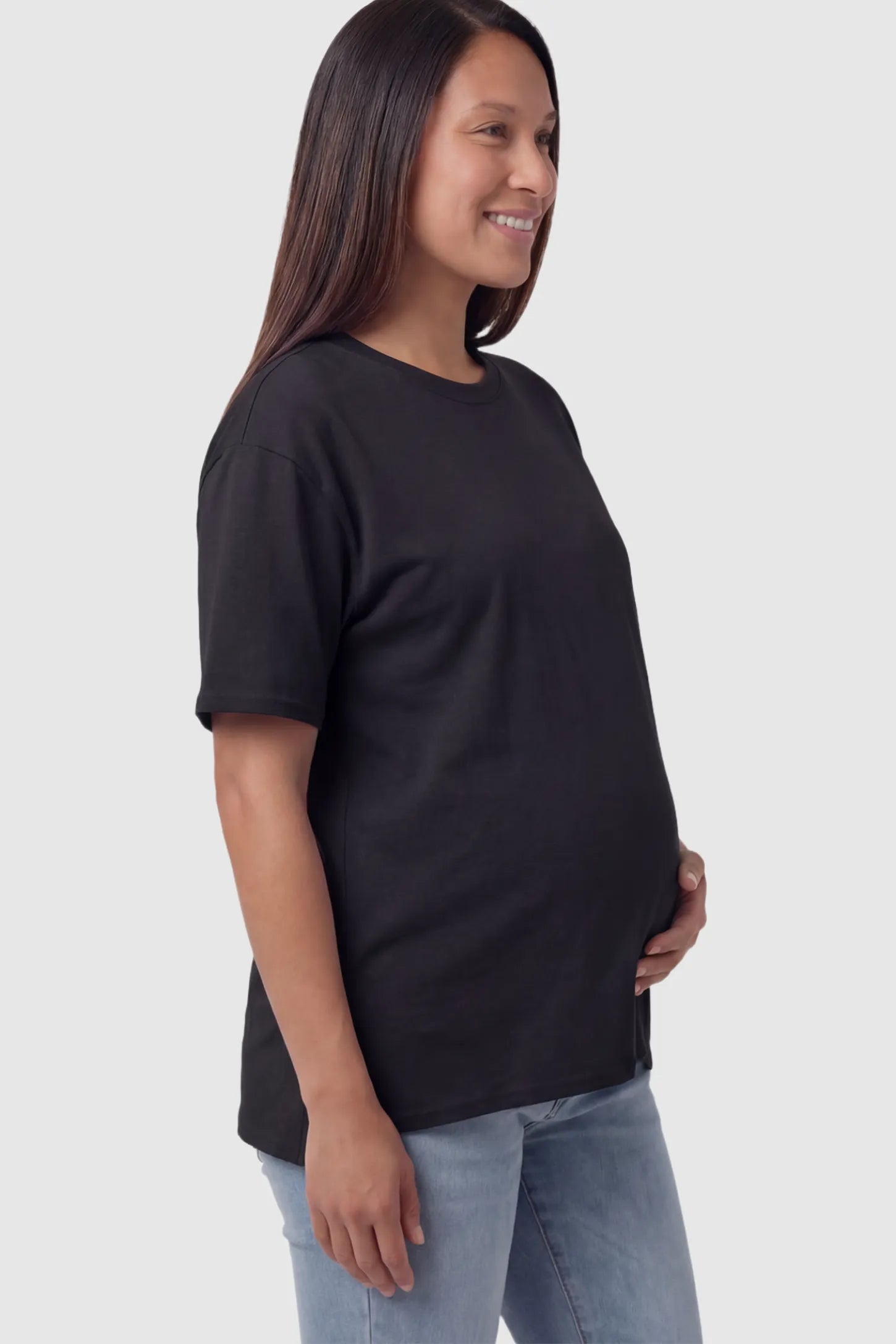 Maternity Side-Slit Crew Neck Short Sleeve in Black featuring an oversized wrinkle-resistant fit on a pregnant model.