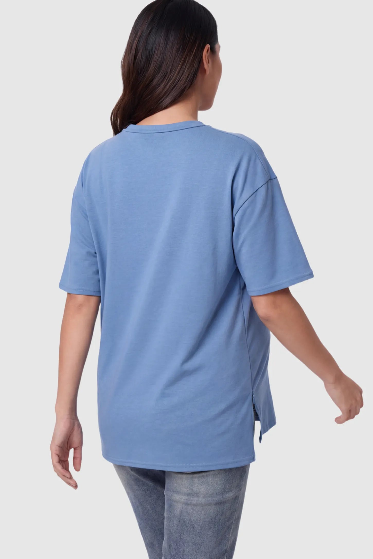 Crew Neck Short Sleeve Maternity T-Shirt Maternity Side-Slit Crew Neck Short Sleeve in Blue featuring an oversized wrinkle-resistant fit on a pregnant model.