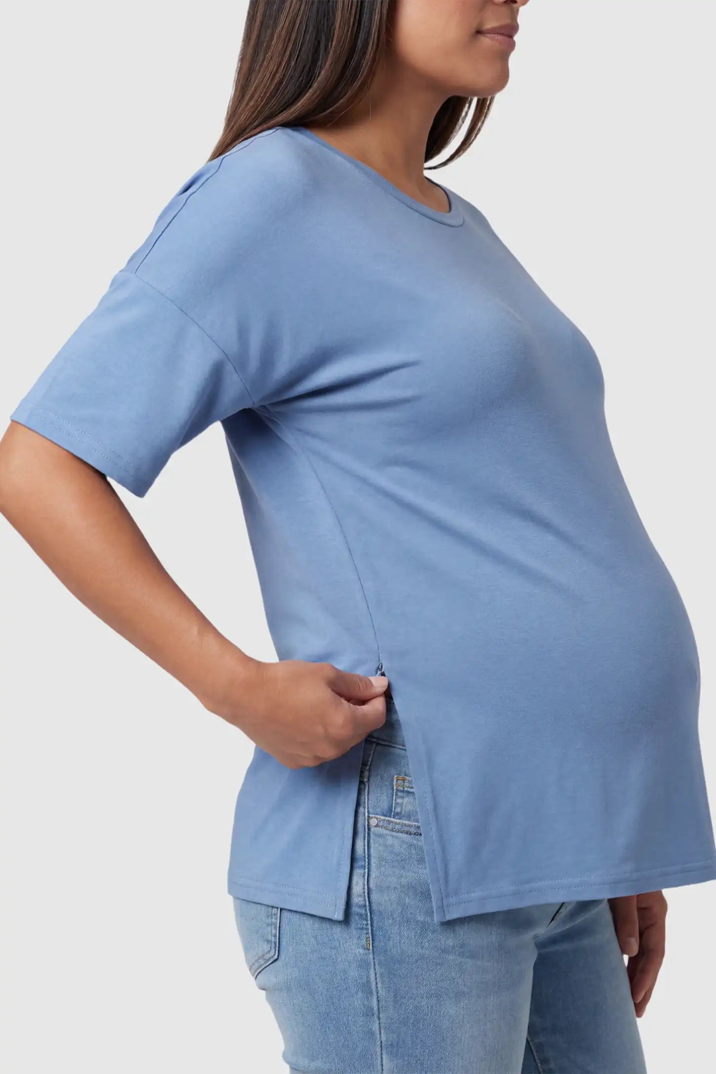 Crew Neck Short Sleeve Maternity T-Shirt Maternity Side-Slit Crew Neck Short Sleeve in Blue featuring an oversized wrinkle-resistant fit on a pregnant model.