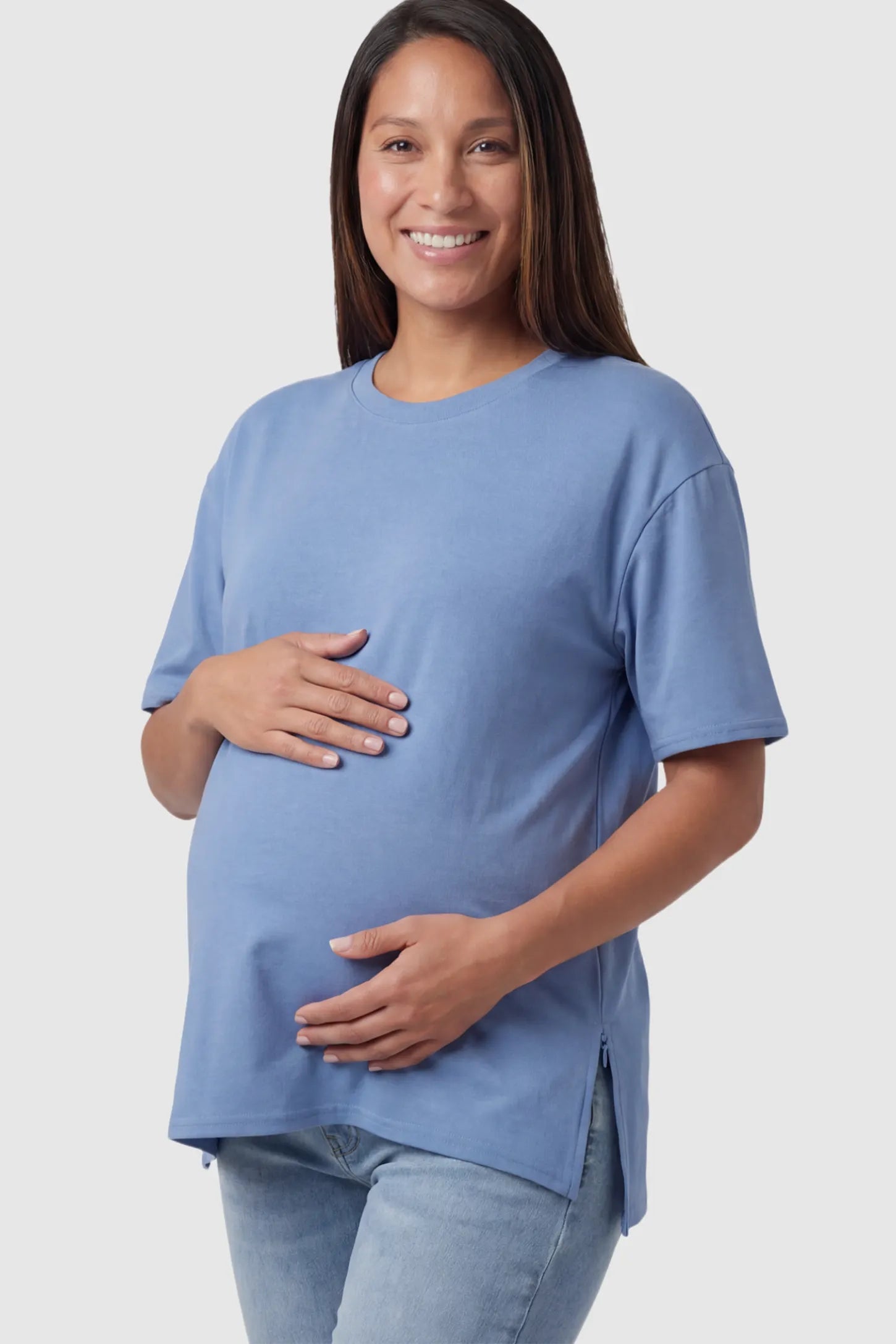 Crew Neck Short Sleeve Maternity T-Shirt Maternity Side-Slit Crew Neck Short Sleeve in Blue featuring an oversized wrinkle-resistant fit on a pregnant model.