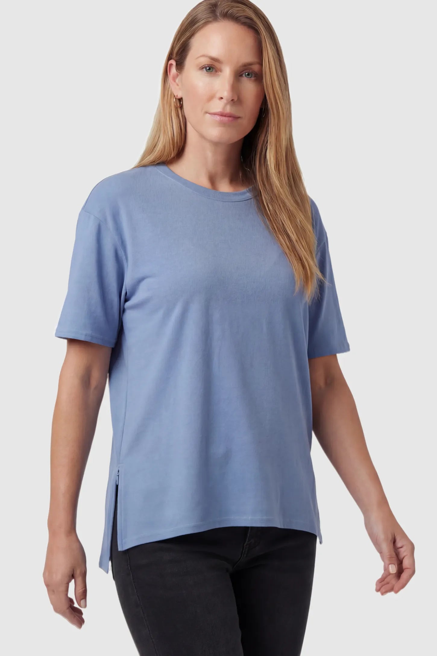 Crew Neck Short Sleeve Maternity T-Shirt Maternity Side-Slit Crew Neck Short Sleeve in Blue featuring an oversized wrinkle-resistant fit on a non pregnant model.