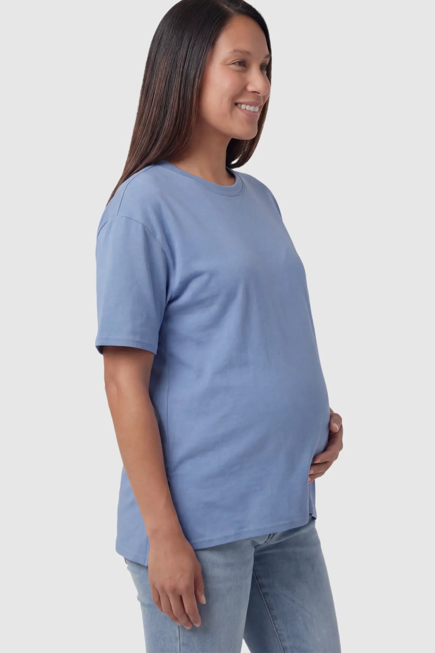 Crew Neck Short Sleeve Maternity T-Shirt Maternity Side-Slit Crew Neck Short Sleeve in Blue featuring an oversized wrinkle-resistant fit on a pregnant model.